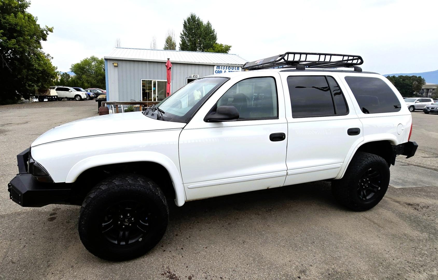 2003 White /Black Dodge Durango SLT 4WD (1D4HS48N03F) with an 4.7L V8 SOHC 16V engine, located at 450 N Russell, Missoula, MT, 59801, (406) 543-6600, 46.874496, -114.017433 - Ready to Go Four Wheeling! Excellent Running 4WD SUV. 4.7L V8 Engine. Automatic Transmission. Aftermarket Front and rear Bumper. Racing Front Seats. 3rd Row Seating. Aftermarket Stereo with Add On Touch Screen. Bluetooth. Air Conditioning. Power Windows and Locks.- Photo#5