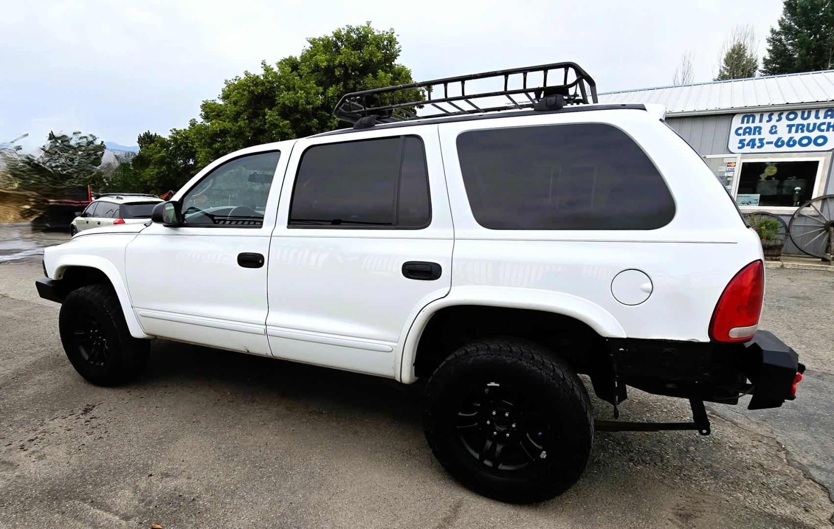2003 White /Black Dodge Durango SLT 4WD (1D4HS48N03F) with an 4.7L V8 SOHC 16V engine, located at 450 N Russell, Missoula, MT, 59801, (406) 543-6600, 46.874496, -114.017433 - Ready to Go Four Wheeling! Excellent Running 4WD SUV. 4.7L V8 Engine. Automatic Transmission. Aftermarket Front and rear Bumper. Racing Front Seats. 3rd Row Seating. Aftermarket Stereo with Add On Touch Screen. Bluetooth. Air Conditioning. Power Windows and Locks.- Photo#6