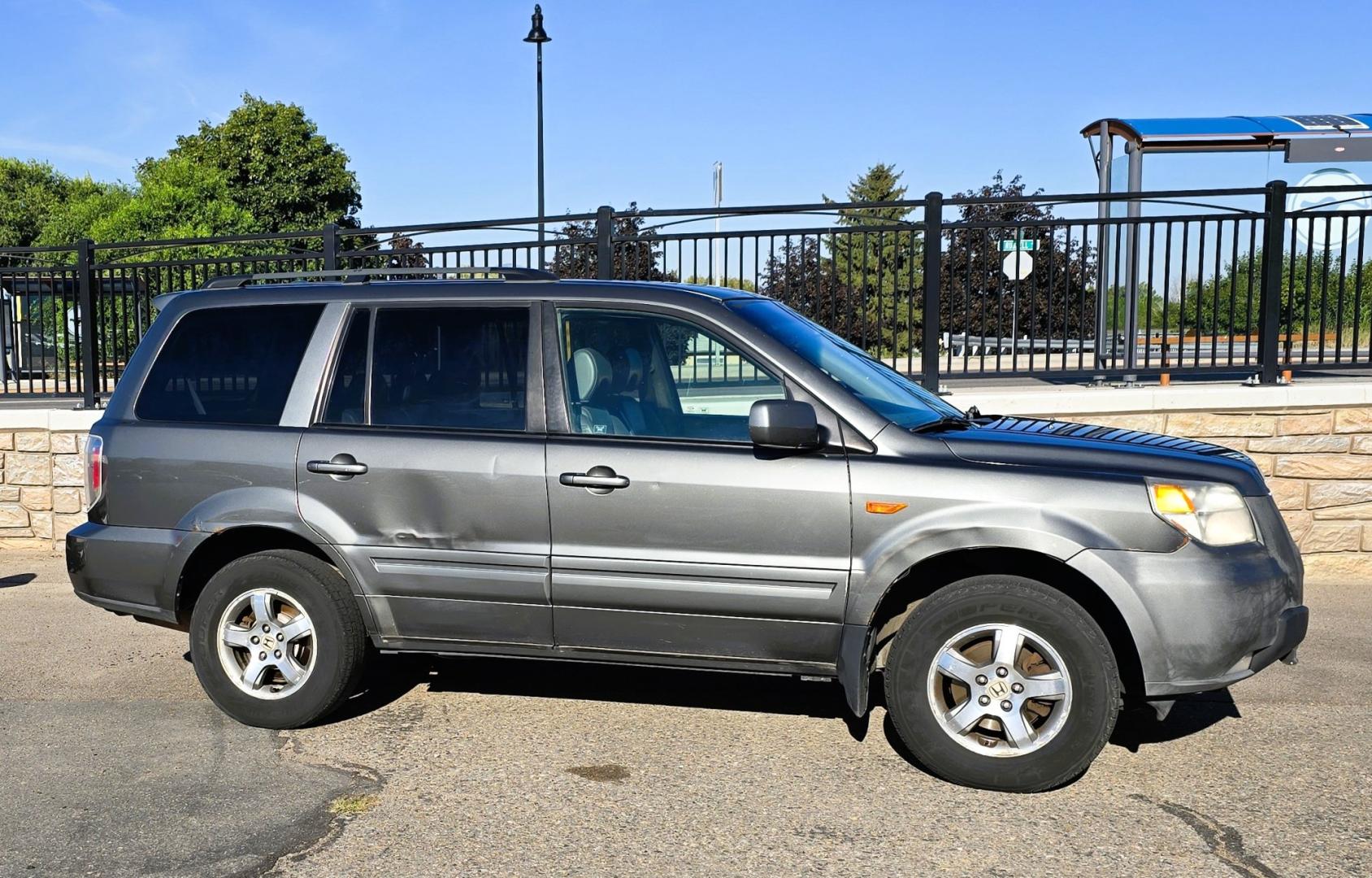 2007 Grey /Gray Honda Pilot EX-L 4WD w/ DVD (2HKYF18607H) with an 3.5L V6 SOHC 24V engine, 5A OD transmission, located at 450 N Russell, Missoula, MT, 59801, (406) 543-6600, 46.874496, -114.017433 - Here's you chance to buy a AWD SUV Honda that runs great for a great price. Lots of miles but you wouldn't know it by how it runs. 3.5L V6 Engine. 3rd Row Seating. Rear Entertainment. Power Drivers Seat. Heated Front Seats. AM FM XM CD Player. Air Conditioning Blows Cold.Sunroof. Power Windows and L- Photo#1