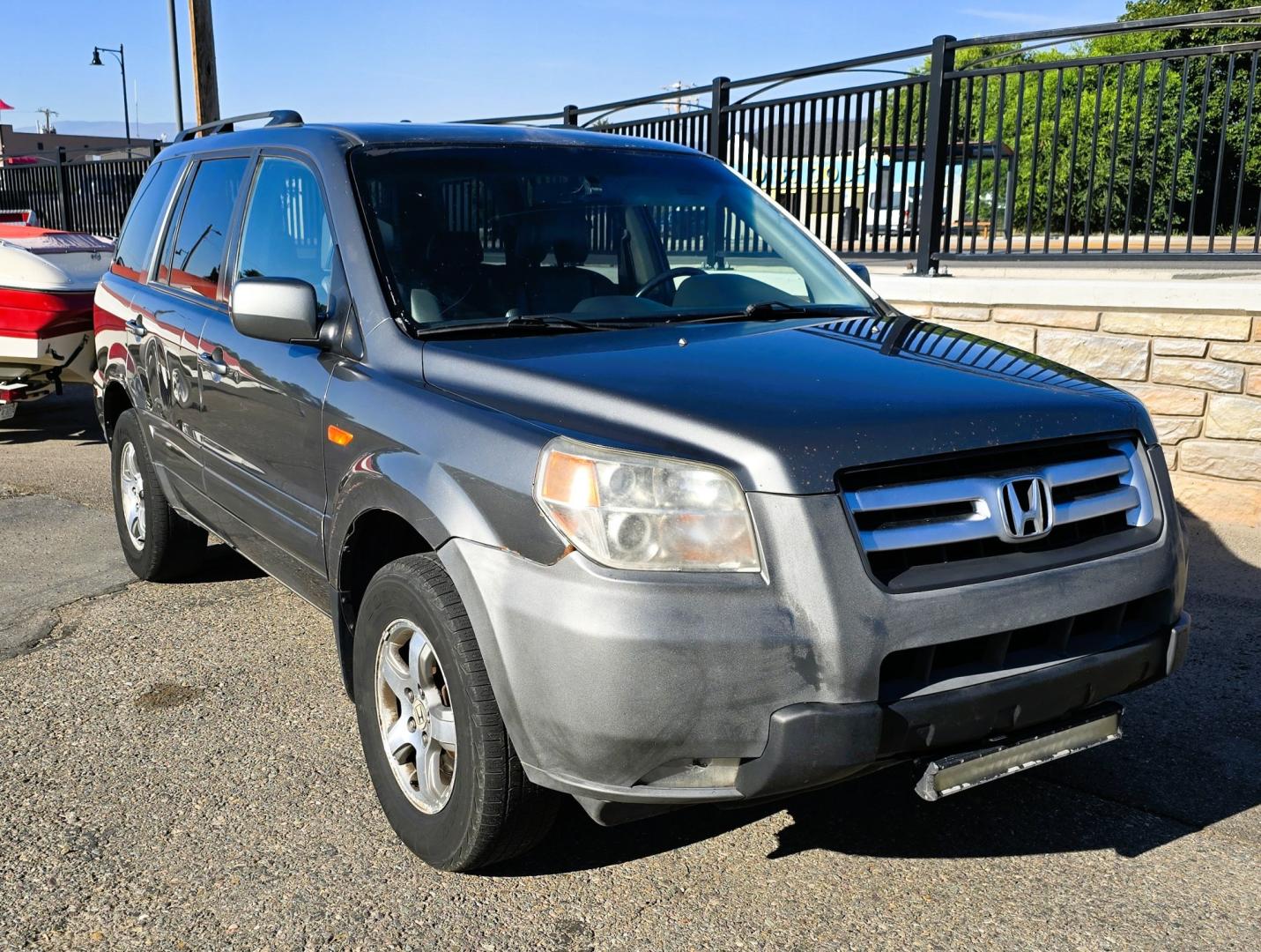 2007 Grey /Gray Honda Pilot EX-L 4WD w/ DVD (2HKYF18607H) with an 3.5L V6 SOHC 24V engine, 5A OD transmission, located at 450 N Russell, Missoula, MT, 59801, (406) 543-6600, 46.874496, -114.017433 - Here's you chance to buy a AWD SUV Honda that runs great for a great price. Lots of miles but you wouldn't know it by how it runs. 3.5L V6 Engine. 3rd Row Seating. Rear Entertainment. Power Drivers Seat. Heated Front Seats. AM FM XM CD Player. Air Conditioning Blows Cold.Sunroof. Power Windows and L- Photo#4