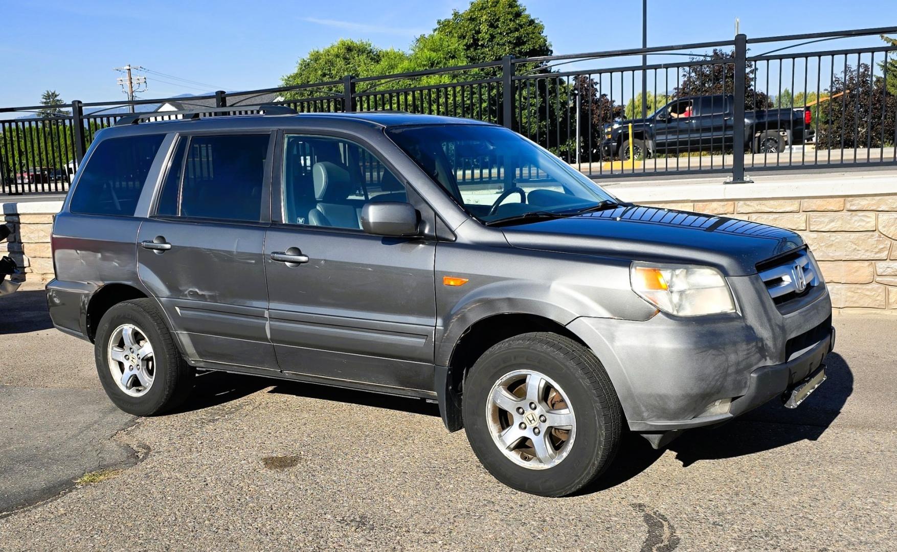 2007 Grey /Gray Honda Pilot EX-L 4WD w/ DVD (2HKYF18607H) with an 3.5L V6 SOHC 24V engine, 5A OD transmission, located at 450 N Russell, Missoula, MT, 59801, (406) 543-6600, 46.874496, -114.017433 - Here's you chance to buy a AWD SUV Honda that runs great for a great price. Lots of miles but you wouldn't know it by how it runs. 3.5L V6 Engine. 3rd Row Seating. Rear Entertainment. Power Drivers Seat. Heated Front Seats. AM FM XM CD Player. Air Conditioning Blows Cold.Sunroof. Power Windows and L- Photo#3