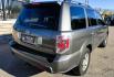 2007 Grey /Gray Honda Pilot EX-L 4WD w/ DVD (2HKYF18607H) with an 3.5L V6 SOHC 24V engine, 5A OD transmission, located at 450 N Russell, Missoula, MT, 59801, (406) 543-6600, 46.874496, -114.017433 - Here's you chance to buy a AWD SUV Honda that runs great for a great price. Lots of miles but you wouldn't know it by how it runs. 3.5L V6 Engine. 3rd Row Seating. Rear Entertainment. Power Drivers Seat. Heated Front Seats. AM FM XM CD Player. Air Conditioning Blows Cold.Sunroof. Power Windows and L- Photo#5