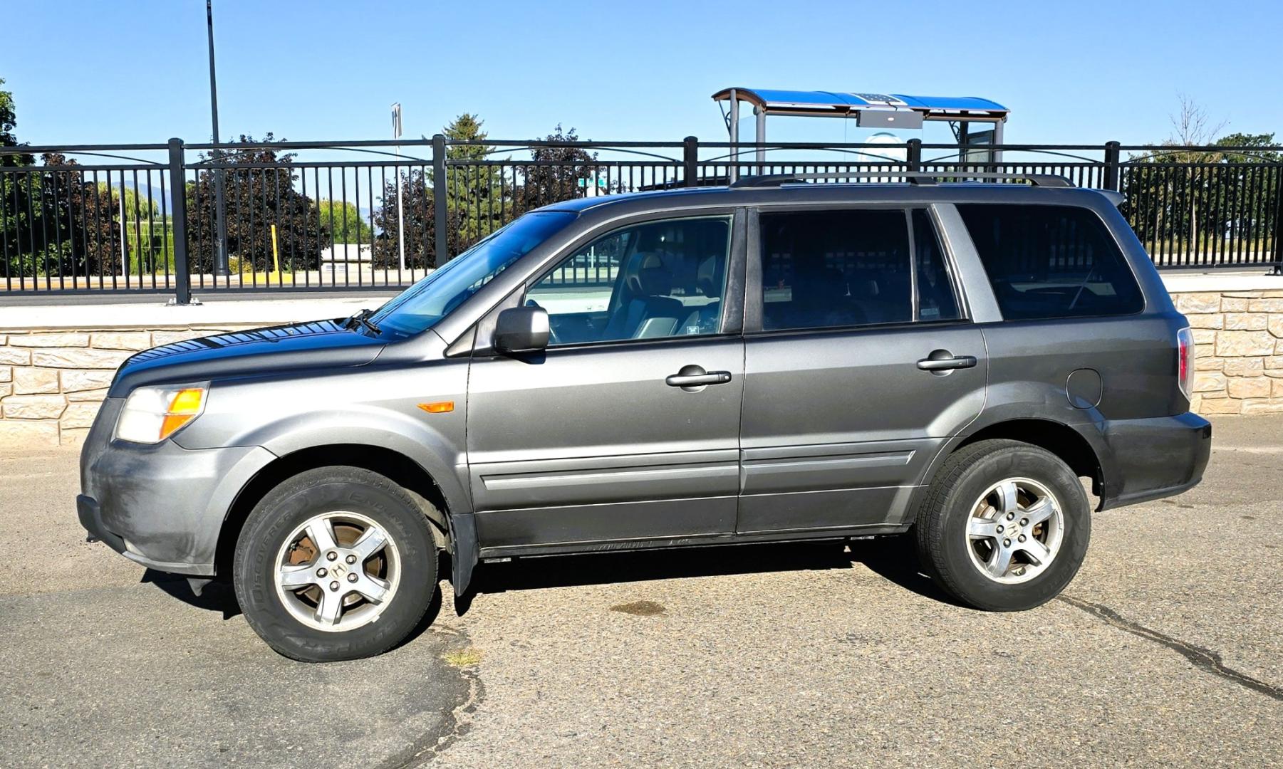 2007 Grey /Gray Honda Pilot EX-L 4WD w/ DVD (2HKYF18607H) with an 3.5L V6 SOHC 24V engine, 5A OD transmission, located at 450 N Russell, Missoula, MT, 59801, (406) 543-6600, 46.874496, -114.017433 - Here's you chance to buy a AWD SUV Honda that runs great for a great price. Lots of miles but you wouldn't know it by how it runs. 3.5L V6 Engine. 3rd Row Seating. Rear Entertainment. Power Drivers Seat. Heated Front Seats. AM FM XM CD Player. Air Conditioning Blows Cold.Sunroof. Power Windows and L- Photo#0