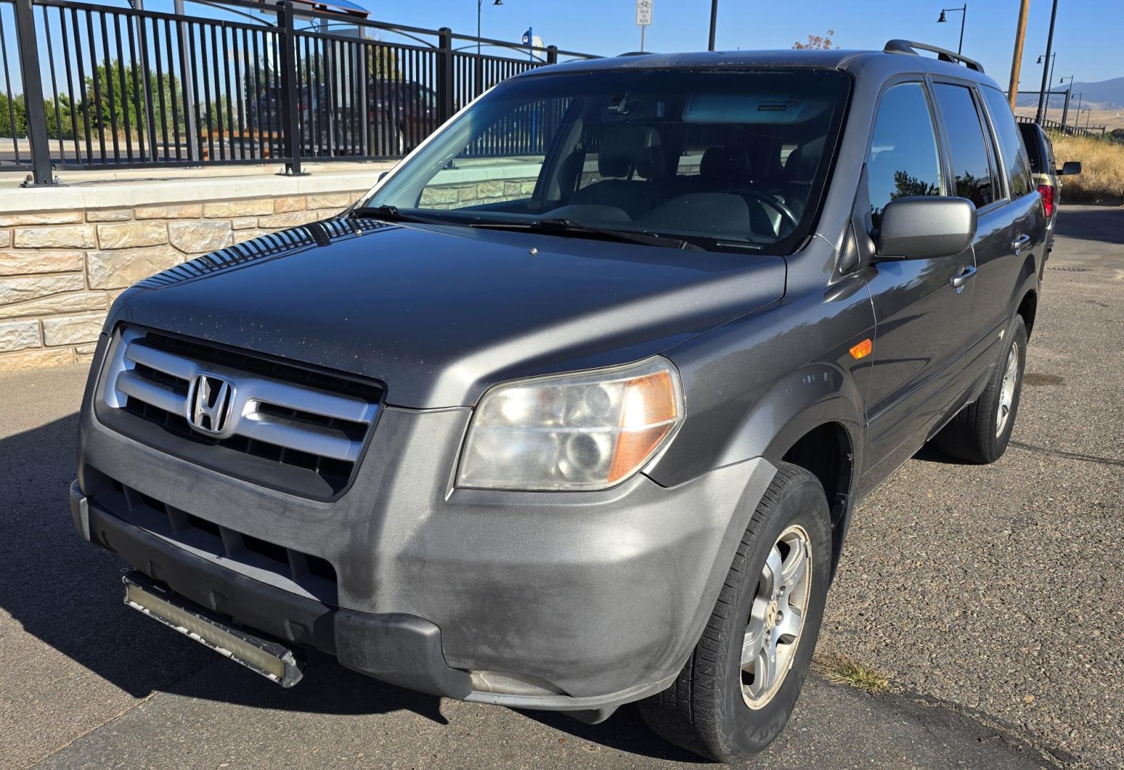 2007 Grey /Gray Honda Pilot EX-L 4WD w/ DVD (2HKYF18607H) with an 3.5L V6 SOHC 24V engine, 5A OD transmission, located at 450 N Russell, Missoula, MT, 59801, (406) 543-6600, 46.874496, -114.017433 - Here's you chance to buy a AWD SUV Honda that runs great for a great price. Lots of miles but you wouldn't know it by how it runs. 3.5L V6 Engine. 3rd Row Seating. Rear Entertainment. Power Drivers Seat. Heated Front Seats. AM FM XM CD Player. Air Conditioning Blows Cold.Sunroof. Power Windows and L- Photo#2