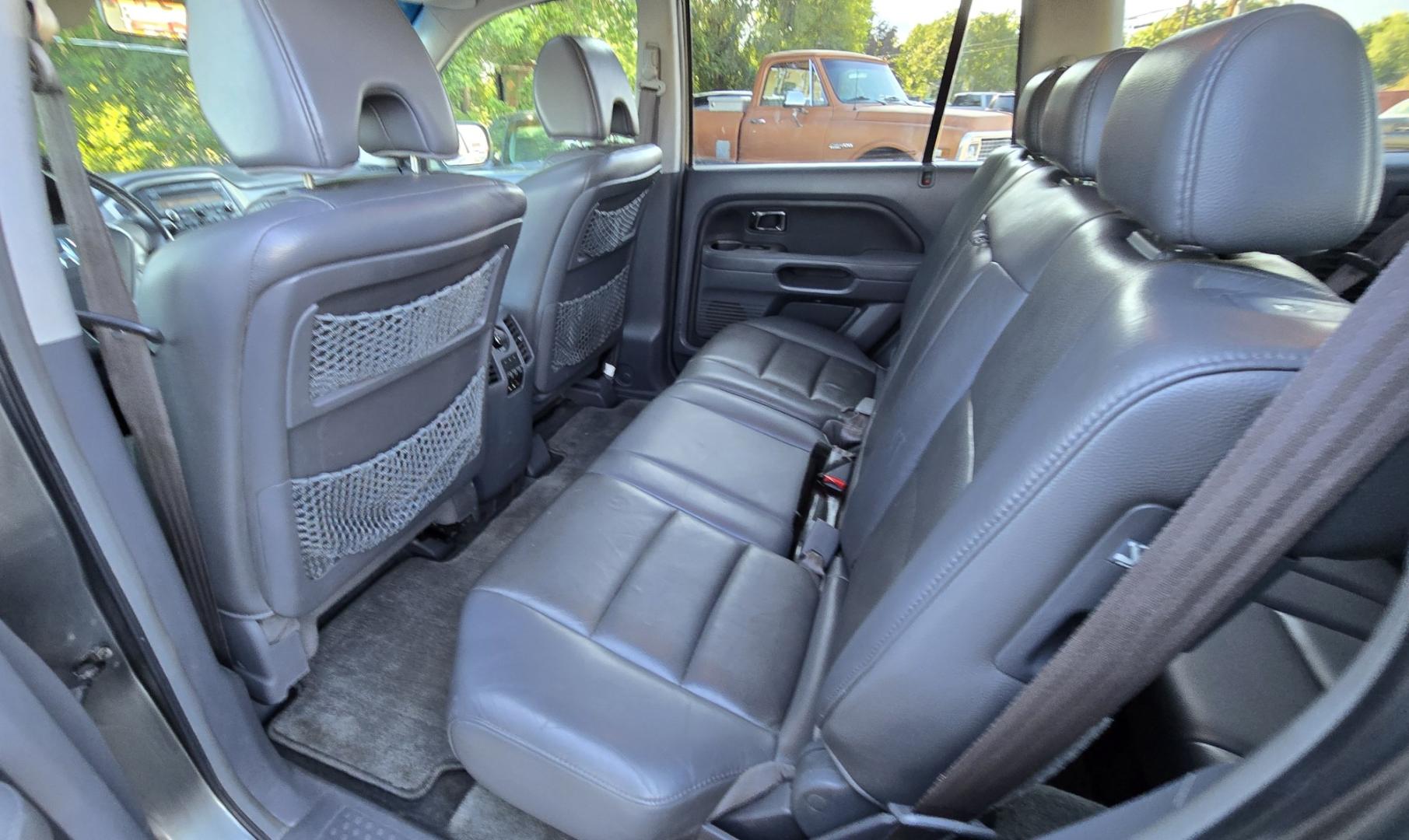 2007 Grey /Gray Honda Pilot EX-L 4WD w/ DVD (2HKYF18607H) with an 3.5L V6 SOHC 24V engine, 5A OD transmission, located at 450 N Russell, Missoula, MT, 59801, (406) 543-6600, 46.874496, -114.017433 - Here's you chance to buy a AWD SUV Honda that runs great for a great price. Lots of miles but you wouldn't know it by how it runs. 3.5L V6 Engine. 3rd Row Seating. Rear Entertainment. Power Drivers Seat. Heated Front Seats. AM FM XM CD Player. Air Conditioning Blows Cold.Sunroof. Power Windows and L- Photo#12