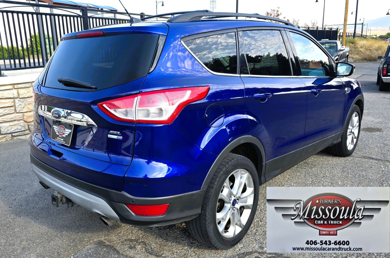 2013 Blue /Tan Ford Escape SEL 4WD (1FMCU9H96DU) with an 2.0L L4 DOHC 16V engine, 6-Speed Automatic transmission, located at 450 N Russell, Missoula, MT, 59801, (406) 543-6600, 46.874496, -114.017433 - Classy Blue Economy Two Owner AWD SUV. 2.0L I4 Engine. 6 Speed Select Shift Automatic Transmission. Navigation. AM FM XM Sync Stereo with CD Player. Bluetooth Audio and Phone Connection. Air Conditioning. Tilt and Telescoping Steering. Backup Camera. Backup Camera. Roof Rack. Towing. Parking Sensors- Photo#2