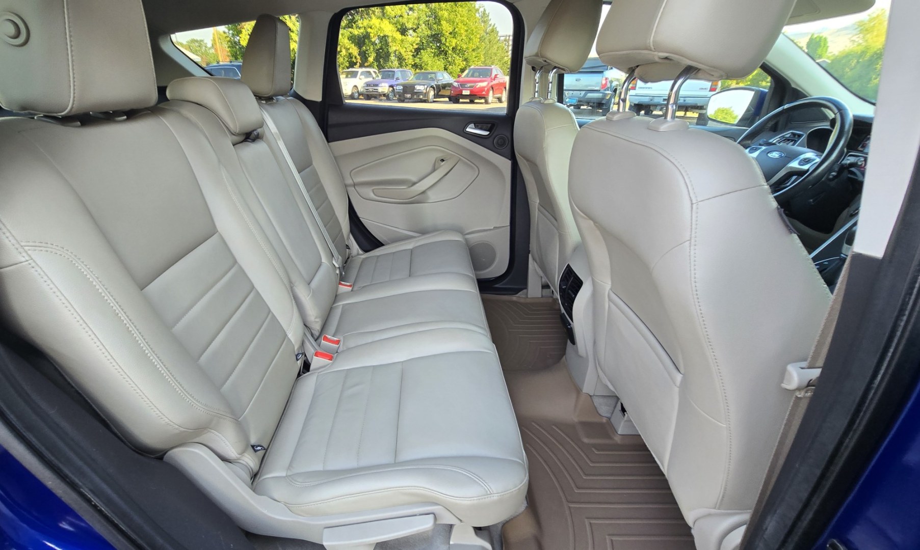 2013 Blue /Tan Ford Escape SEL 4WD (1FMCU9H96DU) with an 2.0L L4 DOHC 16V engine, 6-Speed Automatic transmission, located at 450 N Russell, Missoula, MT, 59801, (406) 543-6600, 46.874496, -114.017433 - Classy Blue Economy Two Owner AWD SUV. 2.0L I4 Engine. 6 Speed Select Shift Automatic Transmission. Navigation. AM FM XM Sync Stereo with CD Player. Bluetooth Audio and Phone Connection. Air Conditioning. Tilt and Telescoping Steering. Backup Camera. Backup Camera. Roof Rack. Towing. Parking Sensors- Photo#17