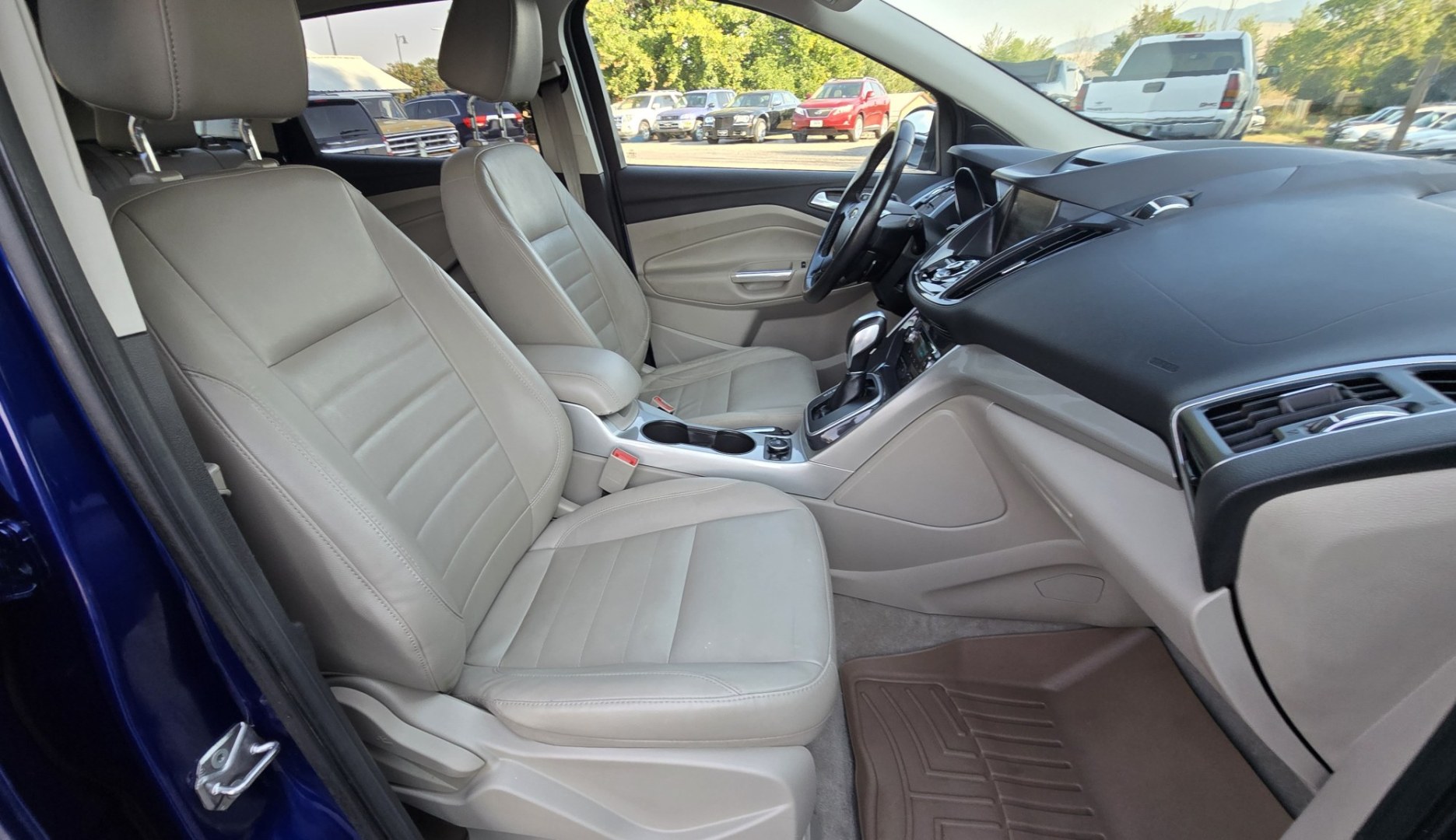 2013 Blue /Tan Ford Escape SEL 4WD (1FMCU9H96DU) with an 2.0L L4 DOHC 16V engine, 6-Speed Automatic transmission, located at 450 N Russell, Missoula, MT, 59801, (406) 543-6600, 46.874496, -114.017433 - Classy Blue Economy Two Owner AWD SUV. 2.0L I4 Engine. 6 Speed Select Shift Automatic Transmission. Navigation. AM FM XM Sync Stereo with CD Player. Bluetooth Audio and Phone Connection. Air Conditioning. Tilt and Telescoping Steering. Backup Camera. Backup Camera. Roof Rack. Towing. Parking Sensors- Photo#16