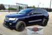 2012 Blue /Black Jeep Grand Cherokee Laredo 4WD (1C4RJFAT3CC) with an 5.7L V8 OHV 16V engine, 5-Speed Automatic transmission, located at 450 N Russell, Missoula, MT, 59801, (406) 543-6600, 46.874496, -114.017433 - Classy 4WD SUV. 5.7L Hemi V8 Engine. Automatic Transmission. Huge Panoramic Sunroof. Remote Ignition. Touch Screen Stereo. Bluetooth Audio and Phone Connection. Navigation. Air. Cruise. Tilt. Power Windows and Locks. New Struts and Shocks. Nice Aftermarket Wheels with like New Tires.- Photo#1