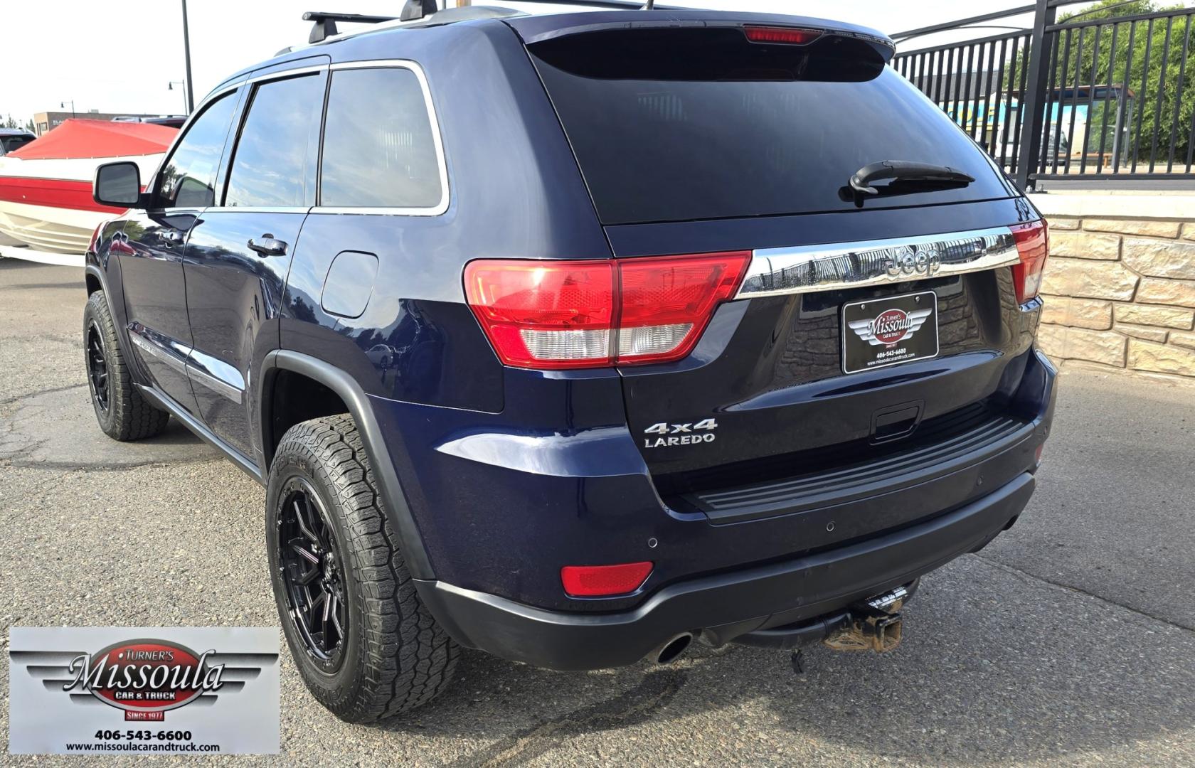 2012 Blue /Black Jeep Grand Cherokee Laredo 4WD (1C4RJFAT3CC) with an 5.7L V8 OHV 16V engine, 5-Speed Automatic transmission, located at 450 N Russell, Missoula, MT, 59801, (406) 543-6600, 46.874496, -114.017433 - Classy 4WD SUV. 5.7L Hemi V8 Engine. Automatic Transmission. Huge Panoramic Sunroof. Remote Ignition. Touch Screen Stereo. Bluetooth Audio and Phone Connection. Navigation. Air. Cruise. Tilt. Power Windows and Locks. New Struts and Shocks. Nice Aftermarket Wheels with like New Tires.- Photo#3