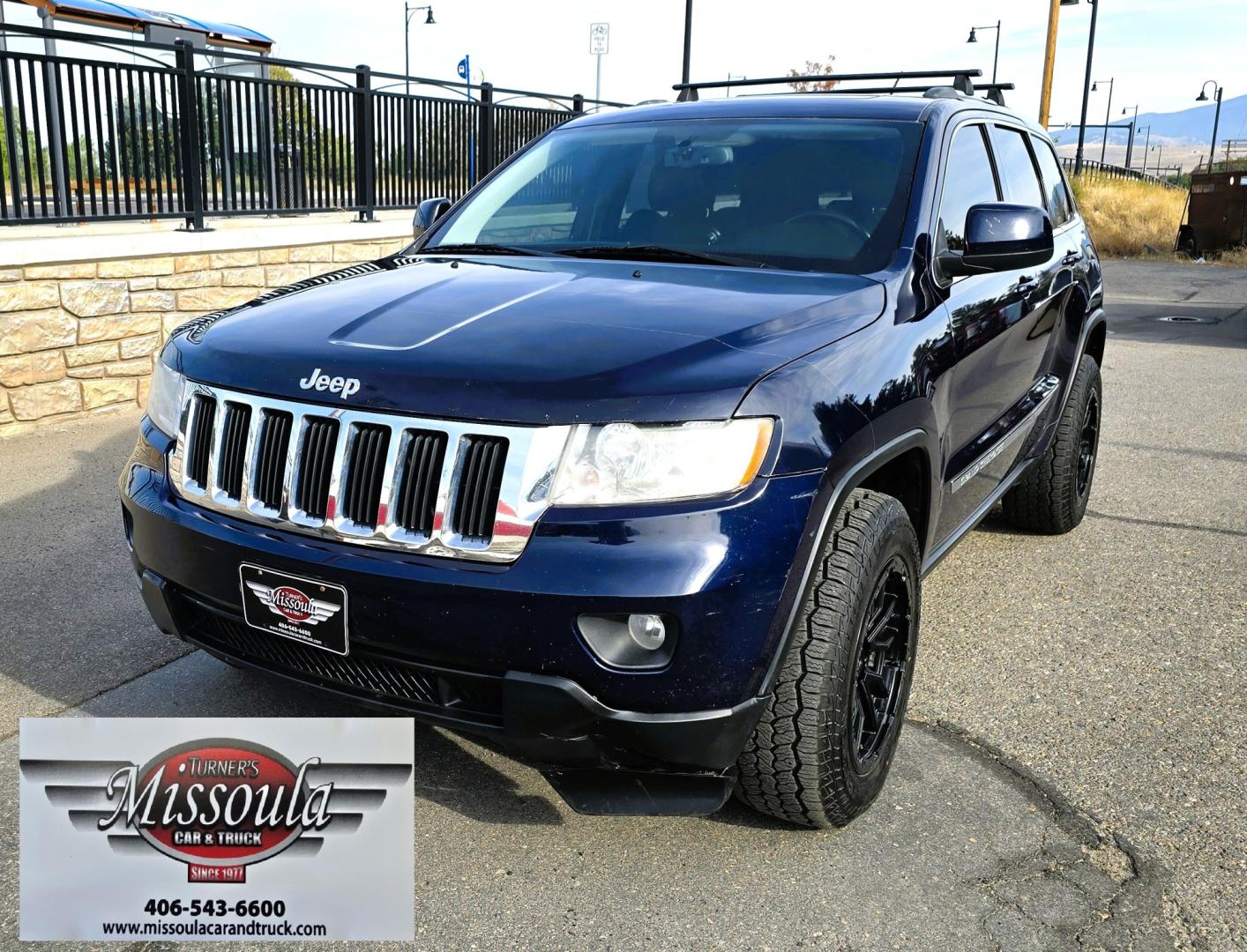 2012 Blue /Black Jeep Grand Cherokee Laredo 4WD (1C4RJFAT3CC) with an 5.7L V8 OHV 16V engine, 5-Speed Automatic transmission, located at 450 N Russell, Missoula, MT, 59801, (406) 543-6600, 46.874496, -114.017433 - Classy 4WD SUV. 5.7L Hemi V8 Engine. Automatic Transmission. Huge Panoramic Sunroof. Remote Ignition. Touch Screen Stereo. Bluetooth Audio and Phone Connection. Navigation. Air. Cruise. Tilt. Power Windows and Locks. New Struts and Shocks. Nice Aftermarket Wheels with like New Tires.- Photo#4