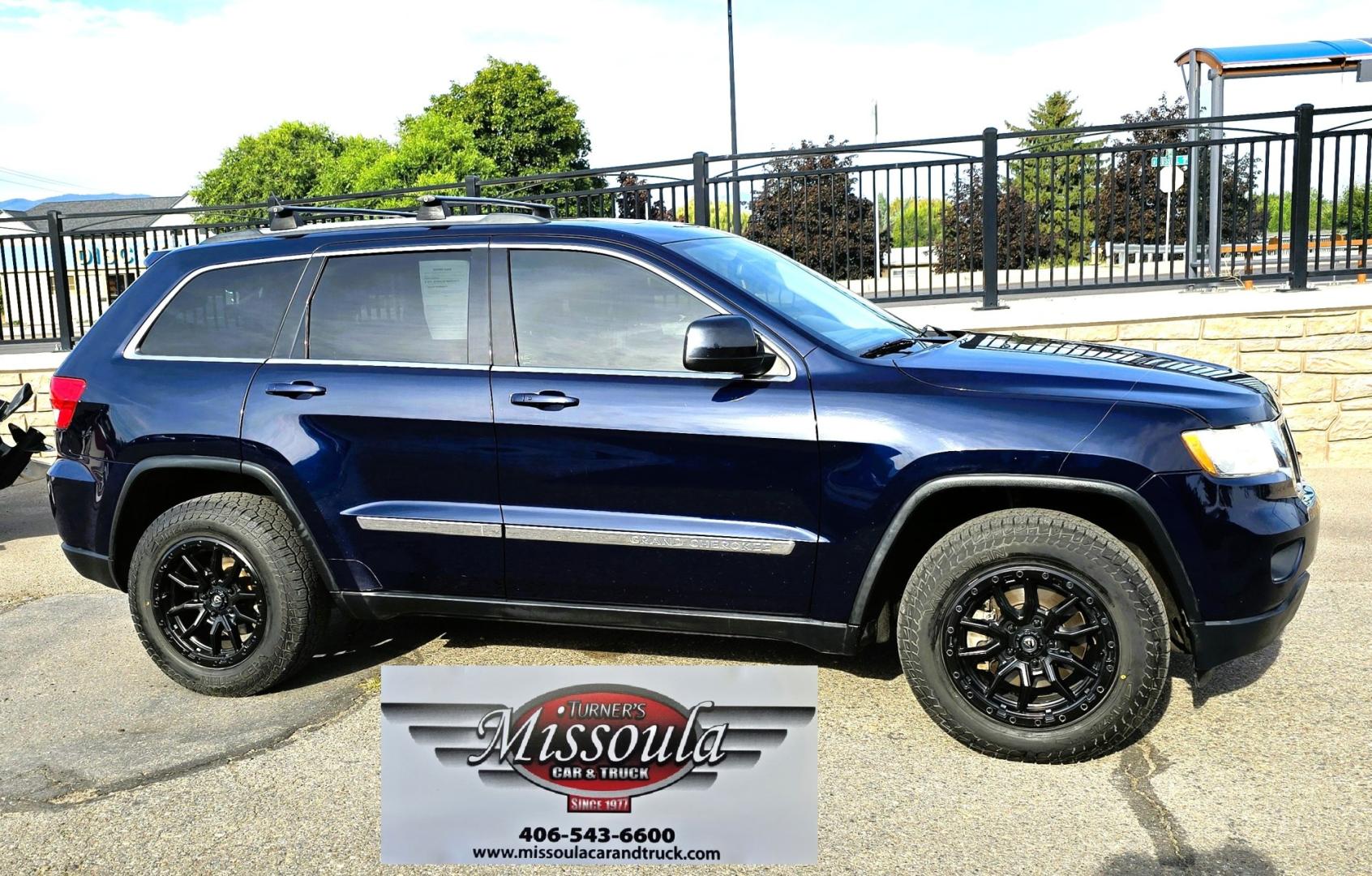 2012 Blue /Black Jeep Grand Cherokee Laredo 4WD (1C4RJFAT3CC) with an 5.7L V8 OHV 16V engine, 5-Speed Automatic transmission, located at 450 N Russell, Missoula, MT, 59801, (406) 543-6600, 46.874496, -114.017433 - Classy 4WD SUV. 5.7L Hemi V8 Engine. Automatic Transmission. Huge Panoramic Sunroof. Remote Ignition. Touch Screen Stereo. Bluetooth Audio and Phone Connection. Navigation. Air. Cruise. Tilt. Power Windows and Locks. New Struts and Shocks. Nice Aftermarket Wheels with like New Tires.- Photo#6