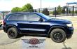 2012 Blue /Black Jeep Grand Cherokee Laredo 4WD (1C4RJFAT3CC) with an 5.7L V8 OHV 16V engine, 5-Speed Automatic transmission, located at 450 N Russell, Missoula, MT, 59801, (406) 543-6600, 46.874496, -114.017433 - Classy 4WD SUV. 5.7L Hemi V8 Engine. Automatic Transmission. Huge Panoramic Sunroof. Remote Ignition. Touch Screen Stereo. Bluetooth Audio and Phone Connection. Navigation. Air. Cruise. Tilt. Power Windows and Locks. New Struts and Shocks. Nice Aftermarket Wheels with like New Tires.- Photo#6