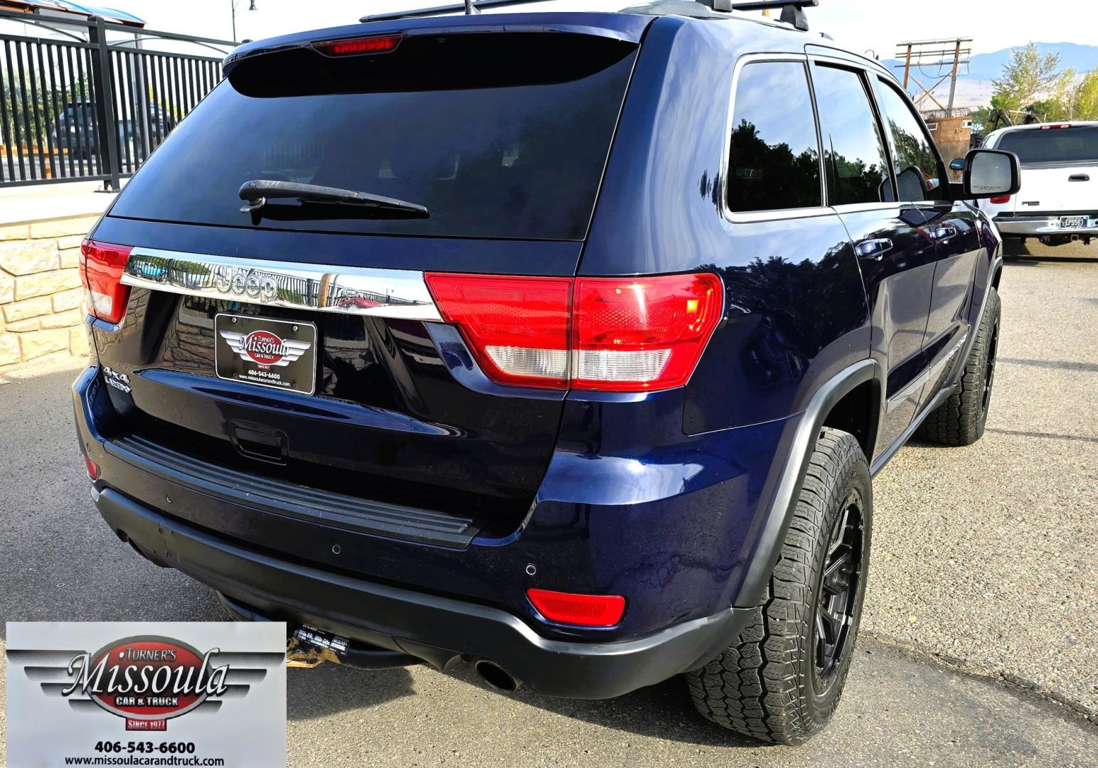2012 Blue /Black Jeep Grand Cherokee Laredo 4WD (1C4RJFAT3CC) with an 5.7L V8 OHV 16V engine, 5-Speed Automatic transmission, located at 450 N Russell, Missoula, MT, 59801, (406) 543-6600, 46.874496, -114.017433 - Classy 4WD SUV. 5.7L Hemi V8 Engine. Automatic Transmission. Huge Panoramic Sunroof. Remote Ignition. Touch Screen Stereo. Bluetooth Audio and Phone Connection. Navigation. Air. Cruise. Tilt. Power Windows and Locks. New Struts and Shocks. Nice Aftermarket Wheels with like New Tires.- Photo#8