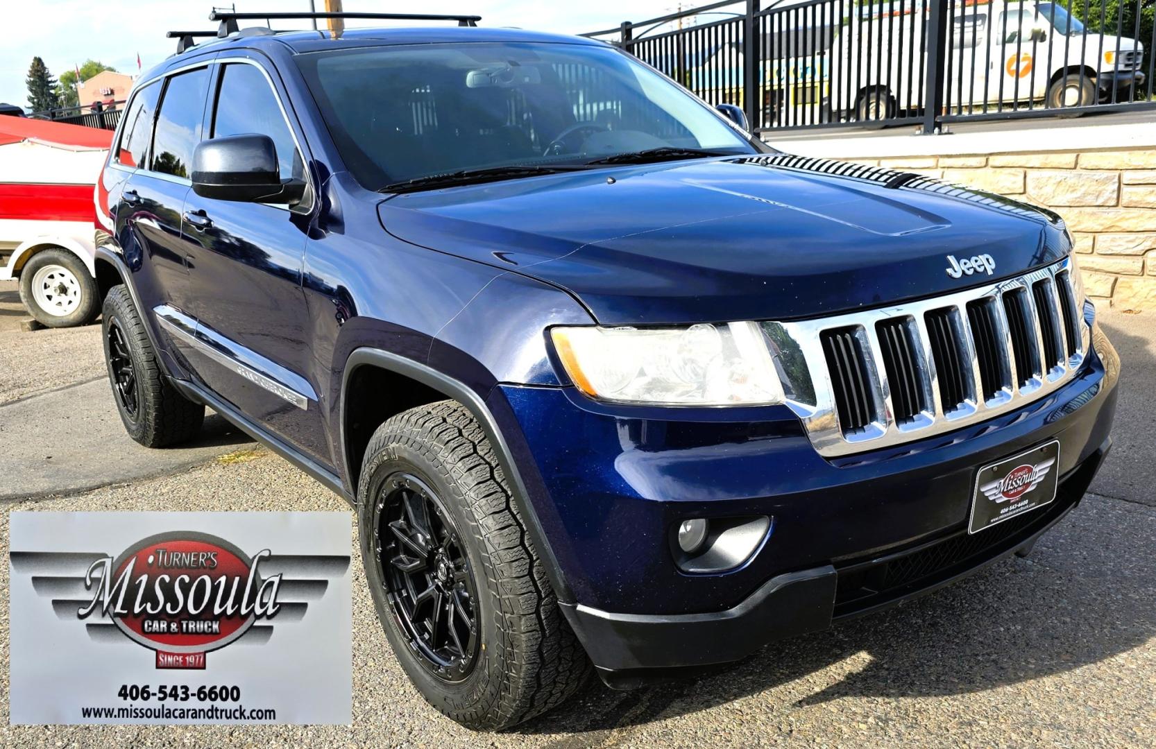 2012 Blue /Black Jeep Grand Cherokee Laredo 4WD (1C4RJFAT3CC) with an 5.7L V8 OHV 16V engine, 5-Speed Automatic transmission, located at 450 N Russell, Missoula, MT, 59801, (406) 543-6600, 46.874496, -114.017433 - Classy 4WD SUV. 5.7L Hemi V8 Engine. Automatic Transmission. Huge Panoramic Sunroof. Remote Ignition. Touch Screen Stereo. Bluetooth Audio and Phone Connection. Navigation. Air. Cruise. Tilt. Power Windows and Locks. New Struts and Shocks. Nice Aftermarket Wheels with like New Tires.- Photo#7