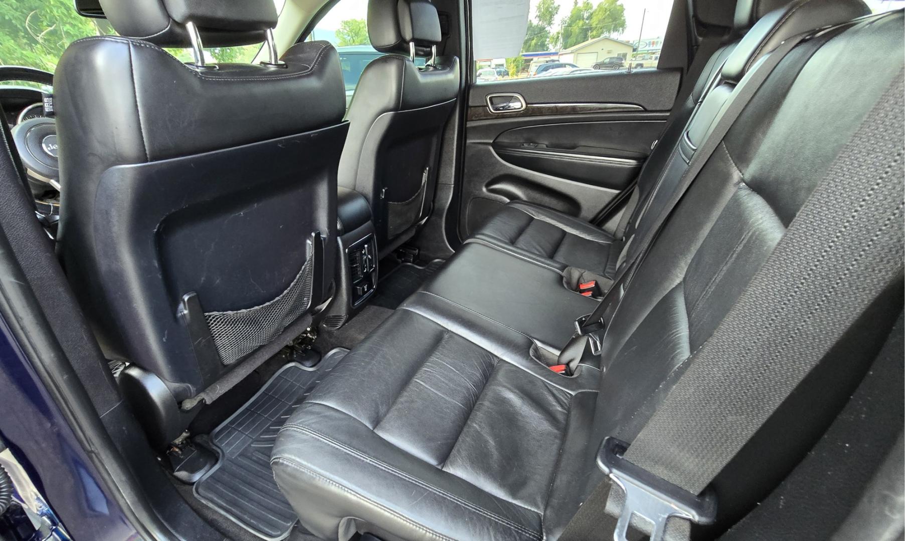 2012 Blue /Black Jeep Grand Cherokee Laredo 4WD (1C4RJFAT3CC) with an 5.7L V8 OHV 16V engine, 5-Speed Automatic transmission, located at 450 N Russell, Missoula, MT, 59801, (406) 543-6600, 46.874496, -114.017433 - Classy 4WD SUV. 5.7L Hemi V8 Engine. Automatic Transmission. Huge Panoramic Sunroof. Remote Ignition. Touch Screen Stereo. Bluetooth Audio and Phone Connection. Navigation. Air. Cruise. Tilt. Power Windows and Locks. New Struts and Shocks. Nice Aftermarket Wheels with like New Tires.- Photo#13