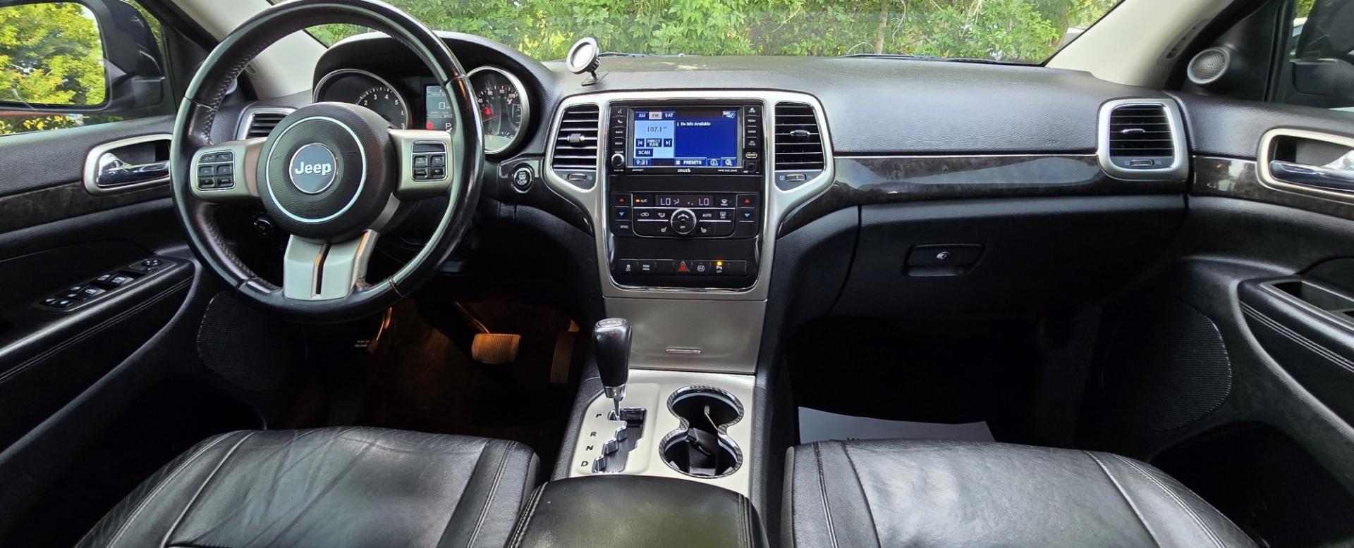 2012 Blue /Black Jeep Grand Cherokee Laredo 4WD (1C4RJFAT3CC) with an 5.7L V8 OHV 16V engine, 5-Speed Automatic transmission, located at 450 N Russell, Missoula, MT, 59801, (406) 543-6600, 46.874496, -114.017433 - Classy 4WD SUV. 5.7L Hemi V8 Engine. Automatic Transmission. Huge Panoramic Sunroof. Remote Ignition. Touch Screen Stereo. Bluetooth Audio and Phone Connection. Navigation. Air. Cruise. Tilt. Power Windows and Locks. New Struts and Shocks. Nice Aftermarket Wheels with like New Tires.- Photo#14