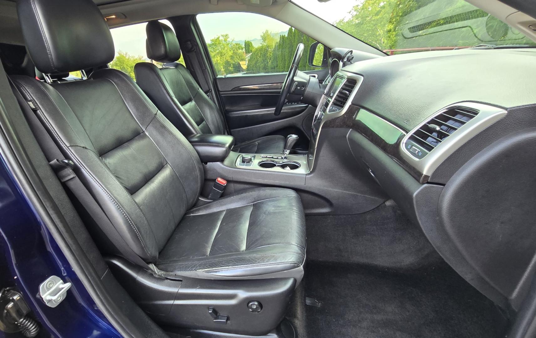 2012 Blue /Black Jeep Grand Cherokee Laredo 4WD (1C4RJFAT3CC) with an 5.7L V8 OHV 16V engine, 5-Speed Automatic transmission, located at 450 N Russell, Missoula, MT, 59801, (406) 543-6600, 46.874496, -114.017433 - Classy 4WD SUV. 5.7L Hemi V8 Engine. Automatic Transmission. Huge Panoramic Sunroof. Remote Ignition. Touch Screen Stereo. Bluetooth Audio and Phone Connection. Navigation. Air. Cruise. Tilt. Power Windows and Locks. New Struts and Shocks. Nice Aftermarket Wheels with like New Tires.- Photo#15