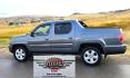 2010 Grey /Black Honda Ridgeline RTL (5FPYK1F58AB) with an 3.5L V6 SOHC 24V engine, 5A transmission, located at 450 N Russell, Missoula, MT, 59801, (406) 543-6600, 46.874496, -114.017433 - Hard to Find AWD Honda Ridgeline. Color is a Gray Green. 3.5L V6 Engine. Leather. Heated Front Seats. Power Sunroof. Power Windows and Locks. Navigation. AM FM XM CD Player. Air Conditioning Blows Cold. Heater Blows Hot. Tilt Steering. Cruise Control. Comfort of a SUV with the Practicality of a Truc- Photo#0
