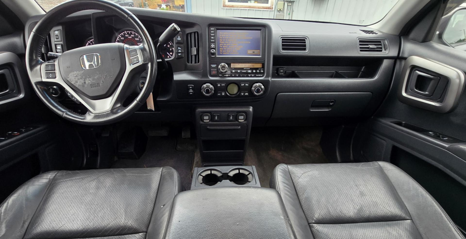 2010 Grey /Black Honda Ridgeline RTL (5FPYK1F58AB) with an 3.5L V6 SOHC 24V engine, 5A transmission, located at 450 N Russell, Missoula, MT, 59801, (406) 543-6600, 46.874496, -114.017433 - Hard to Find AWD Honda Ridgeline. Color is a Gray Green. 3.5L V6 Engine. Leather. Heated Front Seats. Power Sunroof. Power Windows and Locks. Navigation. AM FM XM CD Player. Air Conditioning Blows Cold. Heater Blows Hot. Tilt Steering. Cruise Control. Comfort of a SUV with the Practicality of a Truc- Photo#14