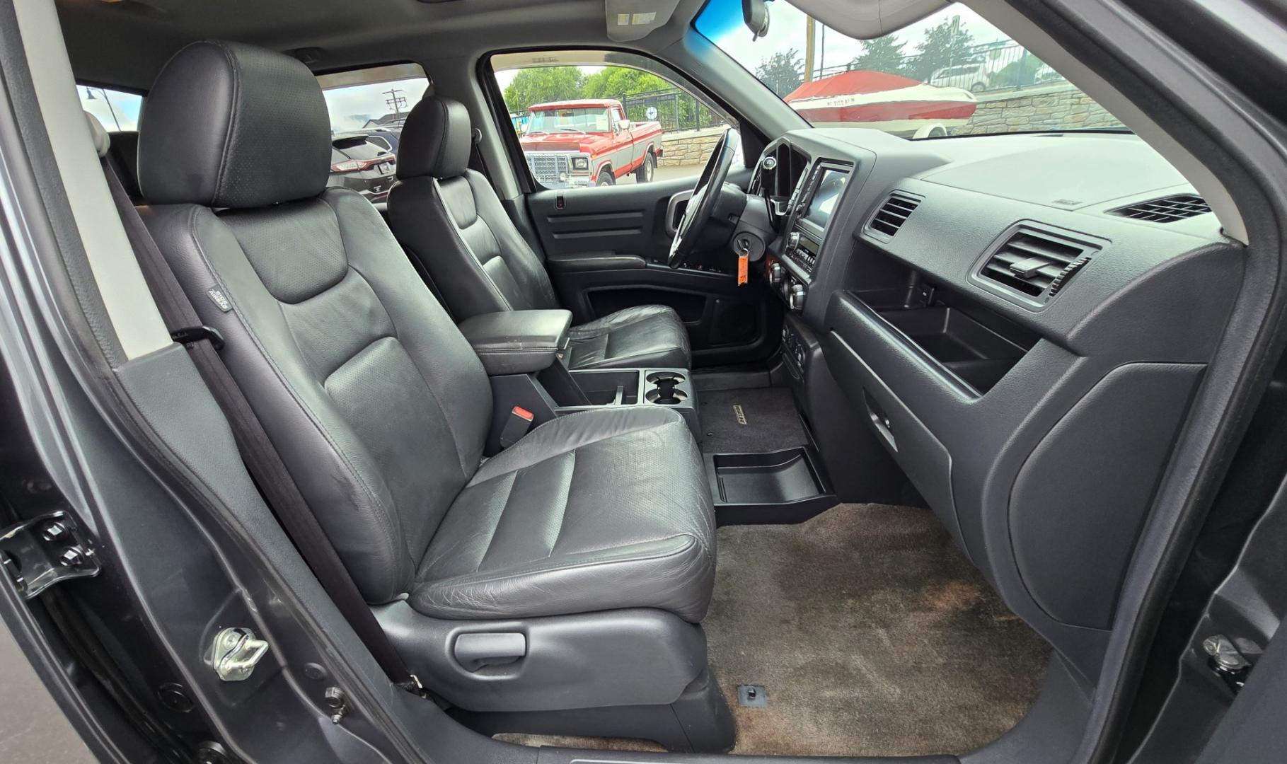2010 Grey /Black Honda Ridgeline RTL (5FPYK1F58AB) with an 3.5L V6 SOHC 24V engine, 5A transmission, located at 450 N Russell, Missoula, MT, 59801, (406) 543-6600, 46.874496, -114.017433 - Hard to Find AWD Honda Ridgeline. Color is a Gray Green. 3.5L V6 Engine. Leather. Heated Front Seats. Power Sunroof. Power Windows and Locks. Navigation. AM FM XM CD Player. Air Conditioning Blows Cold. Heater Blows Hot. Tilt Steering. Cruise Control. Comfort of a SUV with the Practicality of a Truc- Photo#13