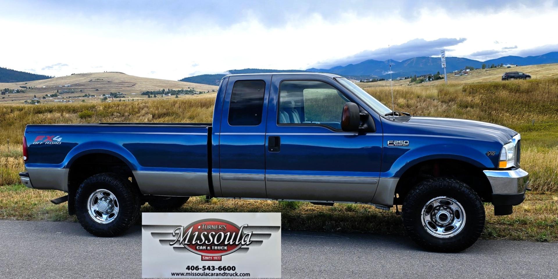 2004 Blue /Tan Ford F-250 SD Lariat SuperCab 4WD (1FTNX21S44E) with an 6.8L V10 SOHC 20V engine, Automatic transmission, located at 450 N Russell, Missoula, MT, 59801, (406) 543-6600, 46.874496, -114.017433 - Heavy Duty Beast of a 4WD Truck. Powerful V10 Engine. Automatic Transmission. Long Bed. Air. Cruise and Tilt. Power Windows and Locks. Torque Converter was Replaced and Tranny services at 137K Miles. Runs and Drives Amazing.- Photo#1