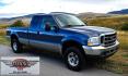 2004 Blue /Tan Ford F-250 SD Lariat SuperCab 4WD (1FTNX21S44E) with an 6.8L V10 SOHC 20V engine, Automatic transmission, located at 450 N Russell, Missoula, MT, 59801, (406) 543-6600, 46.874496, -114.017433 - Heavy Duty Beast of a 4WD Truck. Powerful V10 Engine. Automatic Transmission. Long Bed. Air. Cruise and Tilt. Power Windows and Locks. Torque Converter was Replaced and Tranny services at 137K Miles. Runs and Drives Amazing.- Photo#2