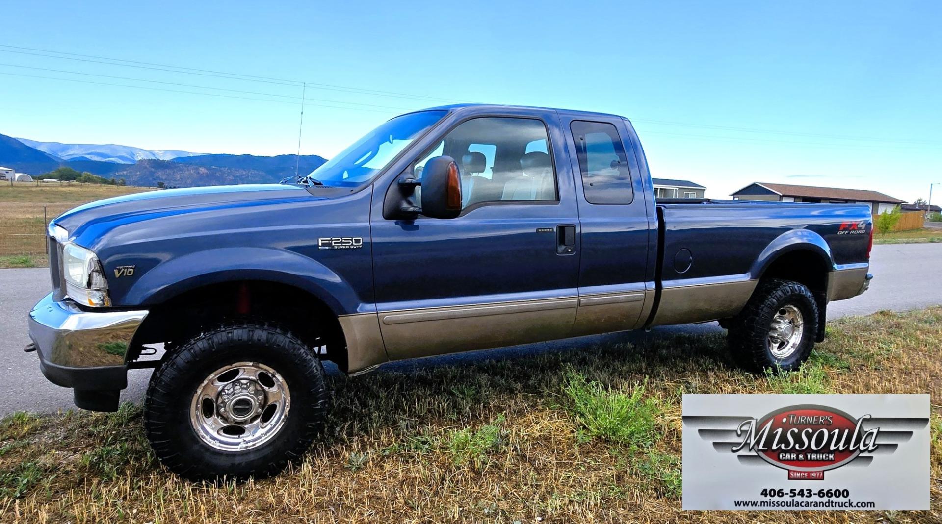 2004 Blue /Tan Ford F-250 SD Lariat SuperCab 4WD (1FTNX21S44E) with an 6.8L V10 SOHC 20V engine, Automatic transmission, located at 450 N Russell, Missoula, MT, 59801, (406) 543-6600, 46.874496, -114.017433 - Heavy Duty Beast of a 4WD Truck. Powerful V10 Engine. Automatic Transmission. Long Bed. Air. Cruise and Tilt. Power Windows and Locks. Torque Converter was Replaced and Tranny services at 137K Miles. Runs and Drives Amazing.- Photo#5