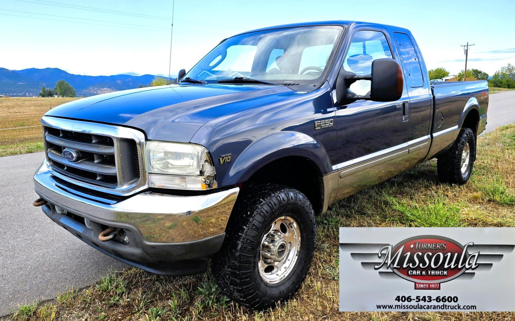 2004 Blue /Tan Ford F-250 SD Lariat SuperCab 4WD (1FTNX21S44E) with an 6.8L V10 SOHC 20V engine, Automatic transmission, located at 450 N Russell, Missoula, MT, 59801, (406) 543-6600, 46.874496, -114.017433 - Heavy Duty Beast of a 4WD Truck. Powerful V10 Engine. Automatic Transmission. Long Bed. Air. Cruise and Tilt. Power Windows and Locks. Torque Converter was Replaced and Tranny services at 137K Miles. Runs and Drives Amazing.- Photo#4