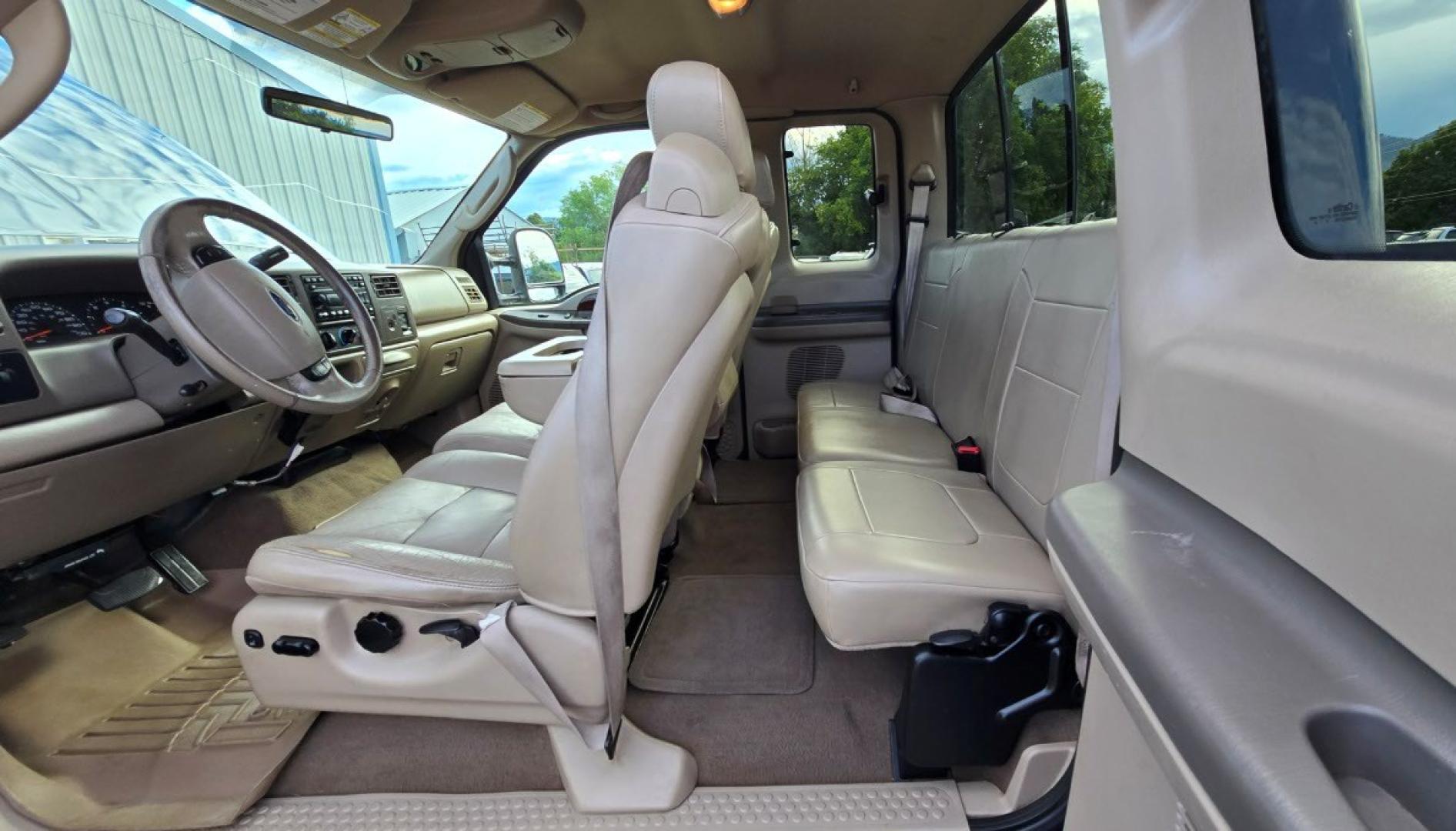2004 Blue /Tan Ford F-250 SD Lariat SuperCab 4WD (1FTNX21S44E) with an 6.8L V10 SOHC 20V engine, Automatic transmission, located at 450 N Russell, Missoula, MT, 59801, (406) 543-6600, 46.874496, -114.017433 - Heavy Duty Beast of a 4WD Truck. Powerful V10 Engine. Automatic Transmission. Long Bed. Air. Cruise and Tilt. Power Windows and Locks. Torque Converter was Replaced and Tranny services at 137K Miles. Runs and Drives Amazing.- Photo#10