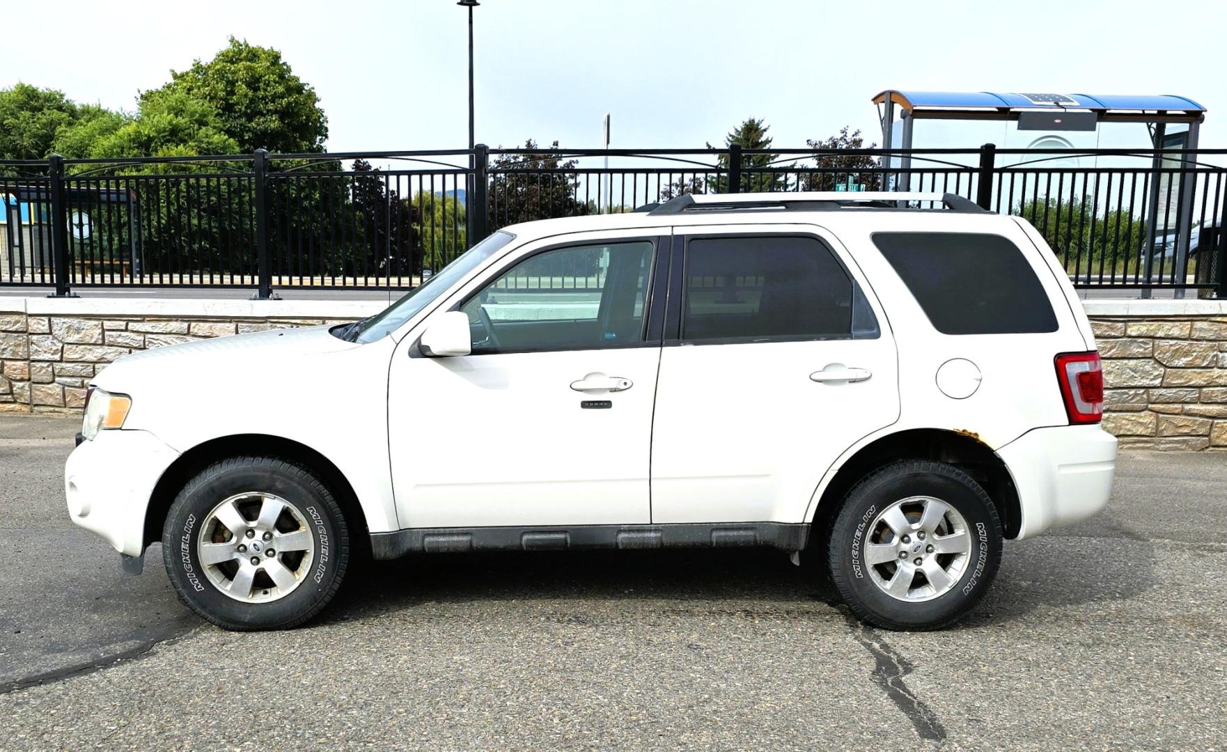 2011 White /Black Ford Escape Limited 4WD (1FMCU9EG3BK) with an 3.0L V6 DOHC 24V engine, 6A transmission, located at 450 N Russell, Missoula, MT, 59801, (406) 543-6600, 46.874496, -114.017433 - AWD SUV. Like New Bridgestone Tires. 3.0 V6 Engine. Automatic Transmission. AM FM CD Player. Bluetooth Phone Connectivity. Air Conditioning. Cruise Control. Power Heated Front Seats.. Power Windows and Locks. Clean Title and Carfax. We Finance through local Credit Unions. We do NOT offer In House- Photo#5
