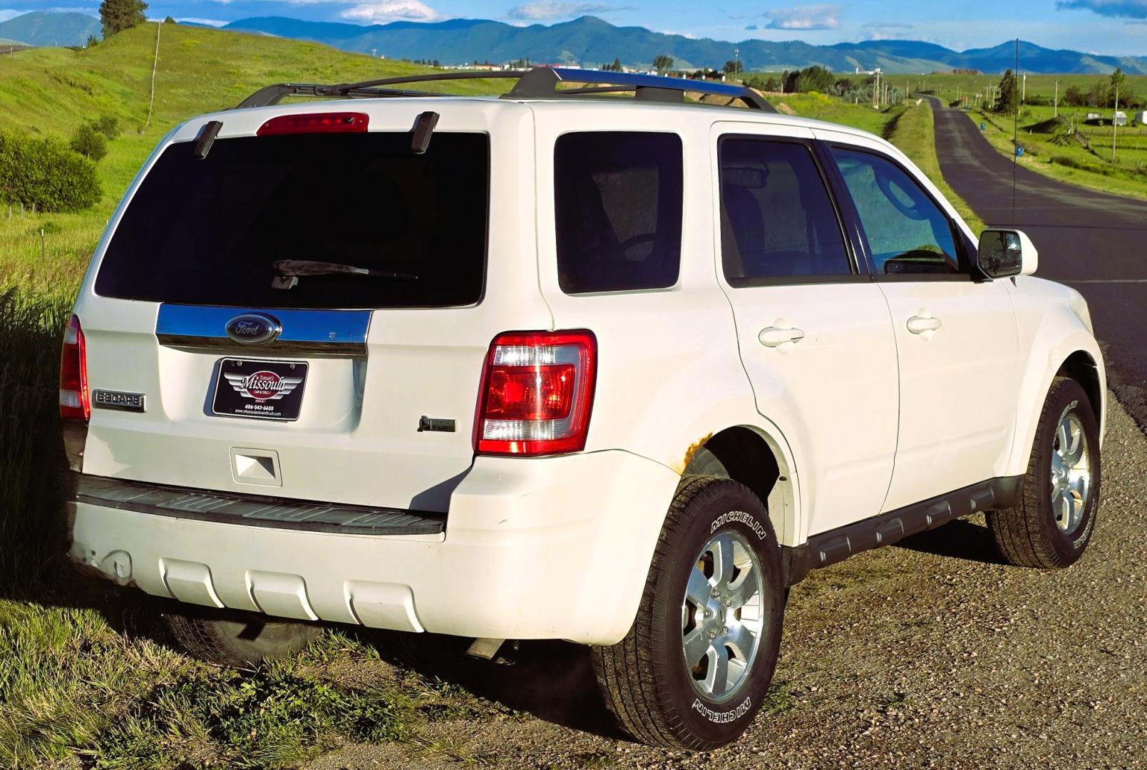 2011 White /Black Ford Escape Limited 4WD (1FMCU9EG3BK) with an 3.0L V6 DOHC 24V engine, 6A transmission, located at 450 N Russell, Missoula, MT, 59801, (406) 543-6600, 46.874496, -114.017433 - AWD SUV. Like New Bridgestone Tires. 3.0 V6 Engine. Automatic Transmission. AM FM CD Player. Bluetooth Phone Connectivity. Air Conditioning. Cruise Control. Power Heated Front Seats.. Power Windows and Locks. Clean Title and Carfax. We Finance through local Credit Unions. We do NOT offer In House- Photo#4