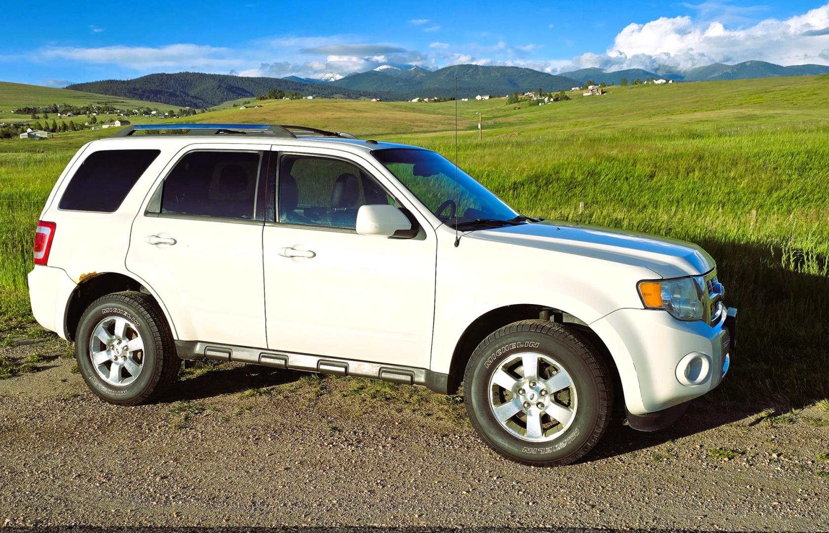 2011 White /Black Ford Escape Limited 4WD (1FMCU9EG3BK) with an 3.0L V6 DOHC 24V engine, 6A transmission, located at 450 N Russell, Missoula, MT, 59801, (406) 543-6600, 46.874496, -114.017433 - AWD SUV. Like New Bridgestone Tires. 3.0 V6 Engine. Automatic Transmission. AM FM CD Player. Bluetooth Phone Connectivity. Air Conditioning. Cruise Control. Power Heated Front Seats.. Power Windows and Locks. Clean Title and Carfax. We Finance through local Credit Unions. We do NOT offer In House- Photo#1