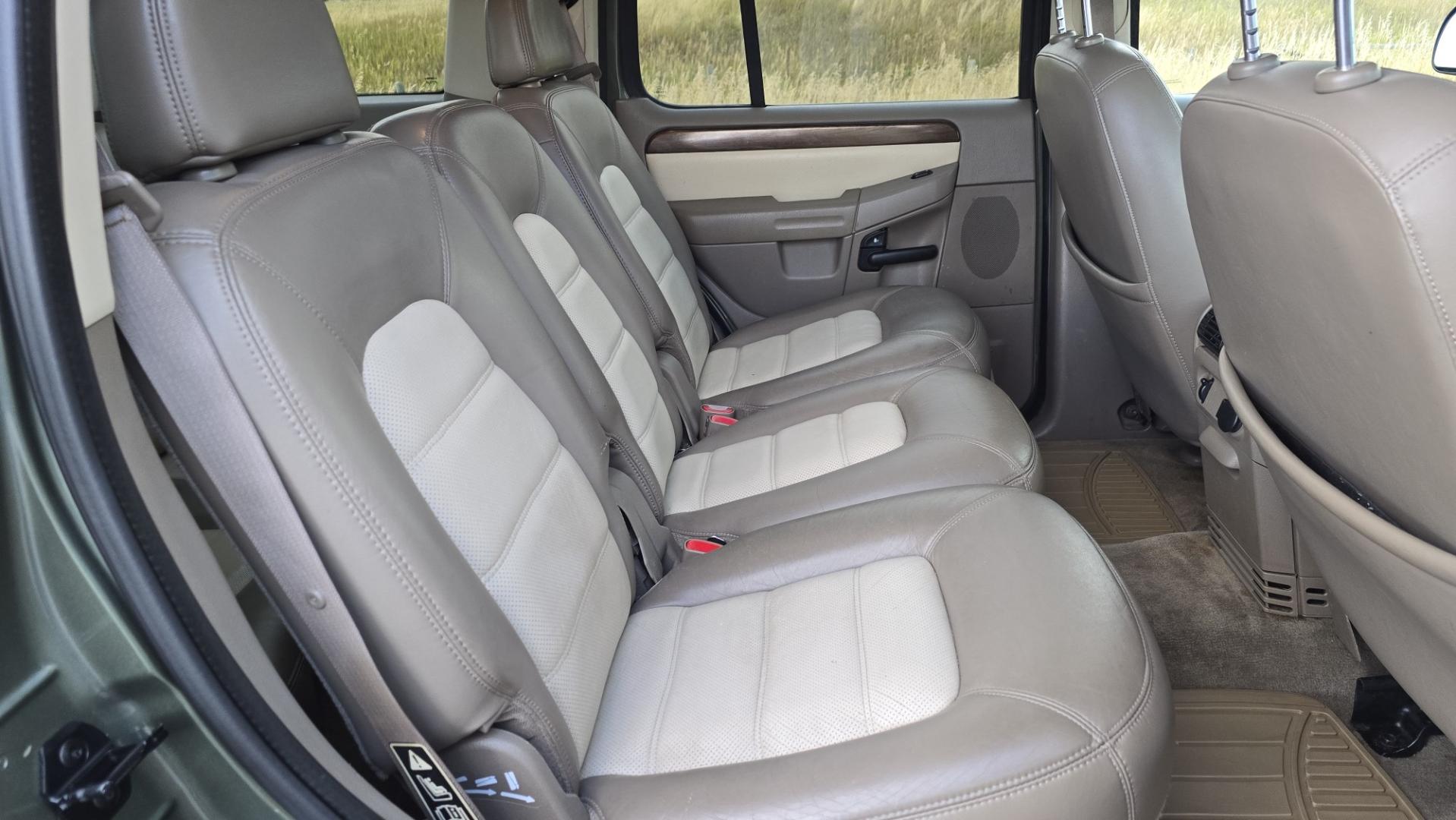 2002 Green /Gray Ford Explorer Eddie Bauer 4WD (1FMDU74E72Z) with an 4.0L V6 SOHC 16V engine, 5A OD transmission, located at 450 N Russell, Missoula, MT, 59801, (406) 543-6600, 46.874496, -114.017433 - Great Running inexpensive 4WD SUV with 3rd Row Seats. Does have a salvage title. 4.0L V6 Engine runs great. 4WD works good. Air Conditioning blows cold. Power Windows and Locks all work. Heated Power Front Seats. Front and Rear Air. Good Tires. Running Boards. The drivers seat has a tear but the res- Photo#12