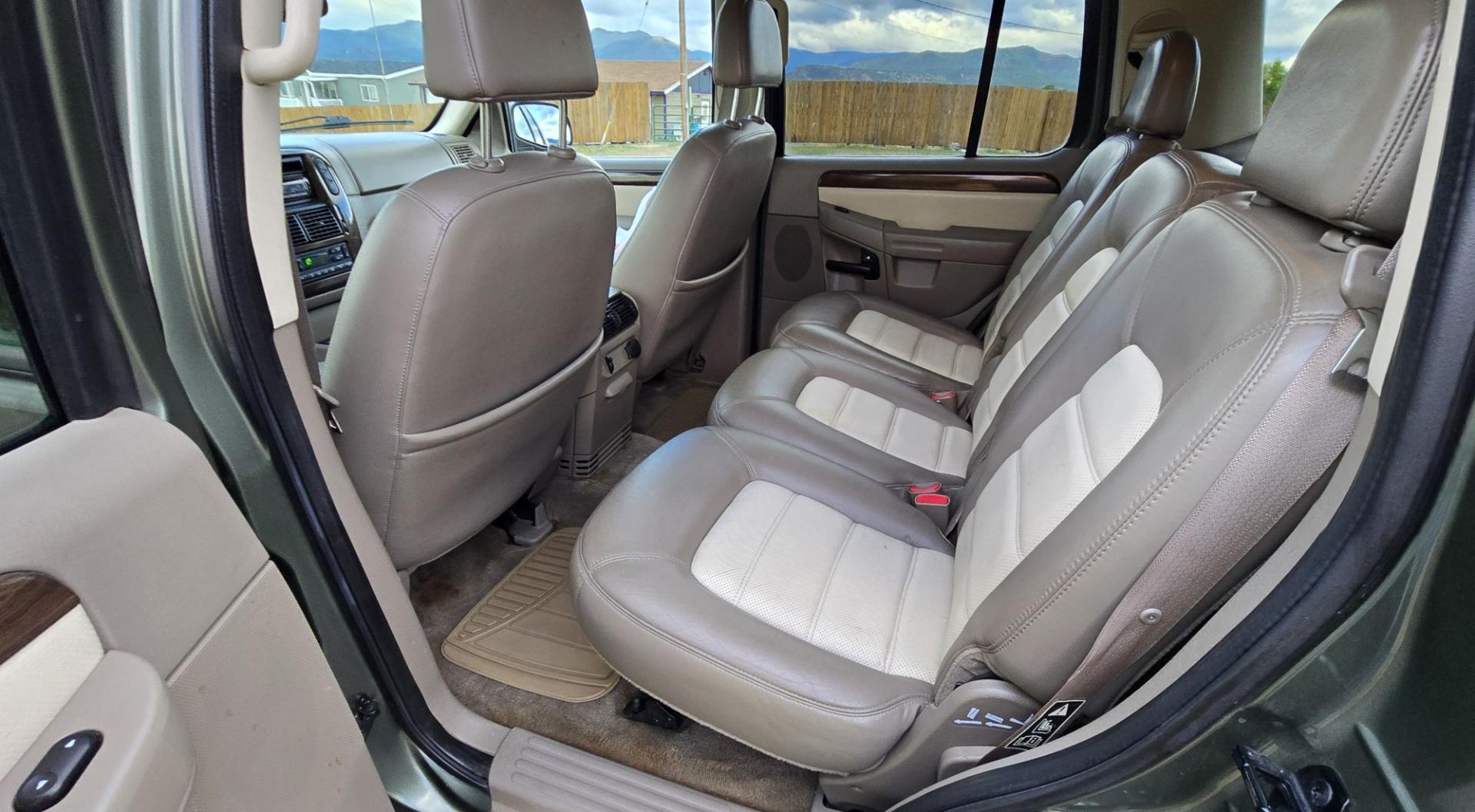 2002 Green /Gray Ford Explorer Eddie Bauer 4WD (1FMDU74E72Z) with an 4.0L V6 SOHC 16V engine, 5A OD transmission, located at 450 N Russell, Missoula, MT, 59801, (406) 543-6600, 46.874496, -114.017433 - Great Running inexpensive 4WD SUV with 3rd Row Seats. Does have a salvage title. 4.0L V6 Engine runs great. 4WD works good. Air Conditioning blows cold. Power Windows and Locks all work. Heated Power Front Seats. Front and Rear Air. Good Tires. Running Boards. The drivers seat has a tear but the res- Photo#13