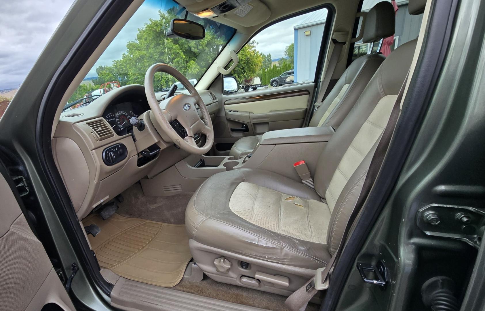 2002 Green /Gray Ford Explorer Eddie Bauer 4WD (1FMDU74E72Z) with an 4.0L V6 SOHC 16V engine, 5A OD transmission, located at 450 N Russell, Missoula, MT, 59801, (406) 543-6600, 46.874496, -114.017433 - Great Running inexpensive 4WD SUV with 3rd Row Seats. Does have a salvage title. 4.0L V6 Engine runs great. 4WD works good. Air Conditioning blows cold. Power Windows and Locks all work. Heated Power Front Seats. Front and Rear Air. Good Tires. Running Boards. The drivers seat has a tear but the res- Photo#19