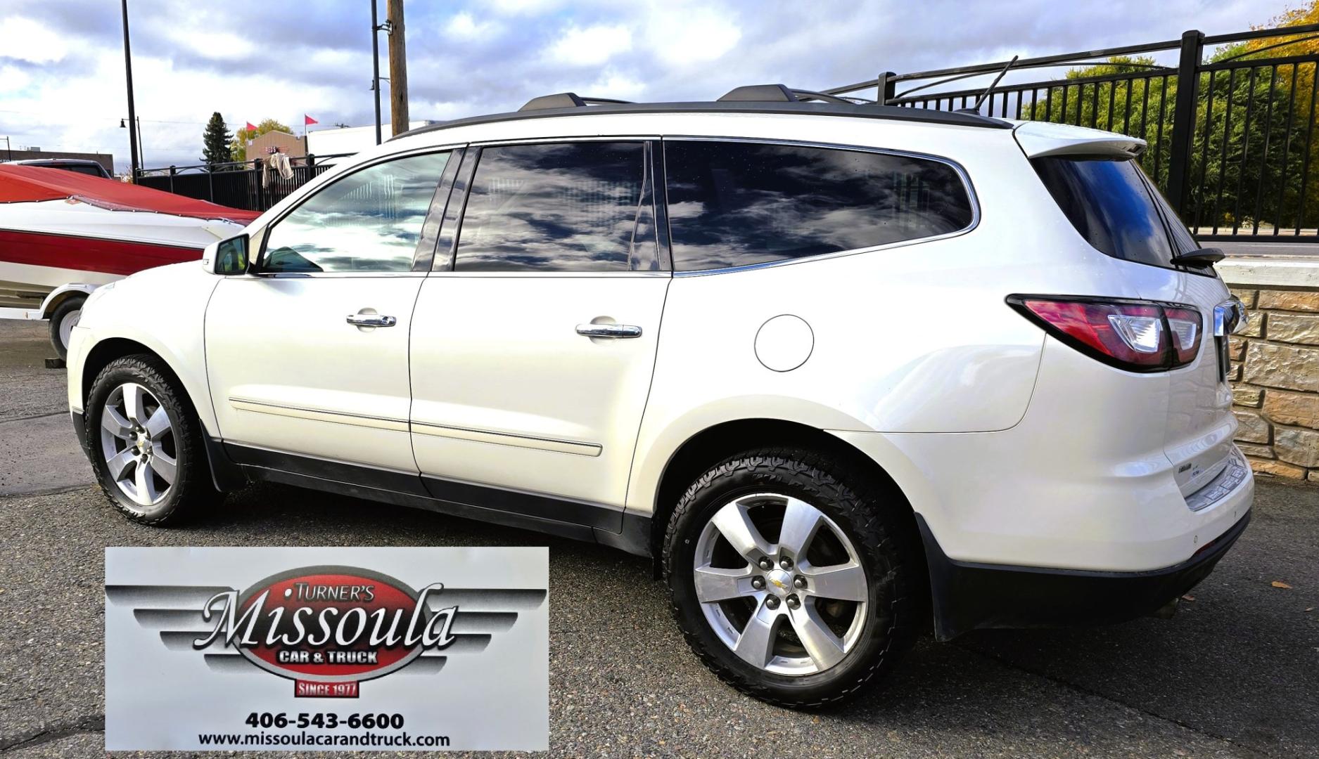 2015 White /Gray Chevrolet Traverse LTZ AWD (1GNKVJKD3FJ) with an 3.6L V6 DOHC 24V engine, 6 Speed Automatic transmission, located at 450 N Russell, Missoula, MT, 59801, (406) 543-6600, 46.874496, -114.017433 - There is a lot of car for the money here. 2015 AWD Chevy Traverse. 3.6L V6 Engine. 6 Speed Automatic Transmission. 3rd Row Seating. Navigation. Backup Camera. Heated and Cooled Front Seats. Two Sunroofs. Front and Rear Climate Control. AM FM CD Player with Touch Screen. Bluetooth Audio and Phone. Cl- Photo#2