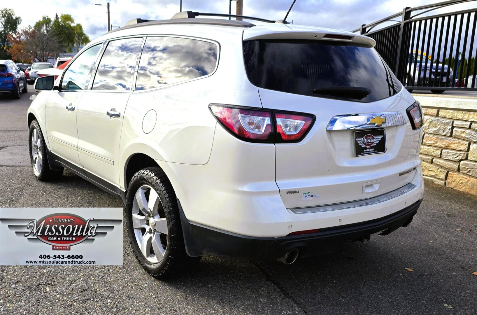2015 White /Gray Chevrolet Traverse LTZ AWD (1GNKVJKD3FJ) with an 3.6L V6 DOHC 24V engine, 6 Speed Automatic transmission, located at 450 N Russell, Missoula, MT, 59801, (406) 543-6600, 46.874496, -114.017433 - There is a lot of car for the money here. 2015 AWD Chevy Traverse. 3.6L V6 Engine. 6 Speed Automatic Transmission. 3rd Row Seating. Navigation. Backup Camera. Heated and Cooled Front Seats. Two Sunroofs. Front and Rear Climate Control. AM FM CD Player with Touch Screen. Bluetooth Audio and Phone. Cl- Photo#3