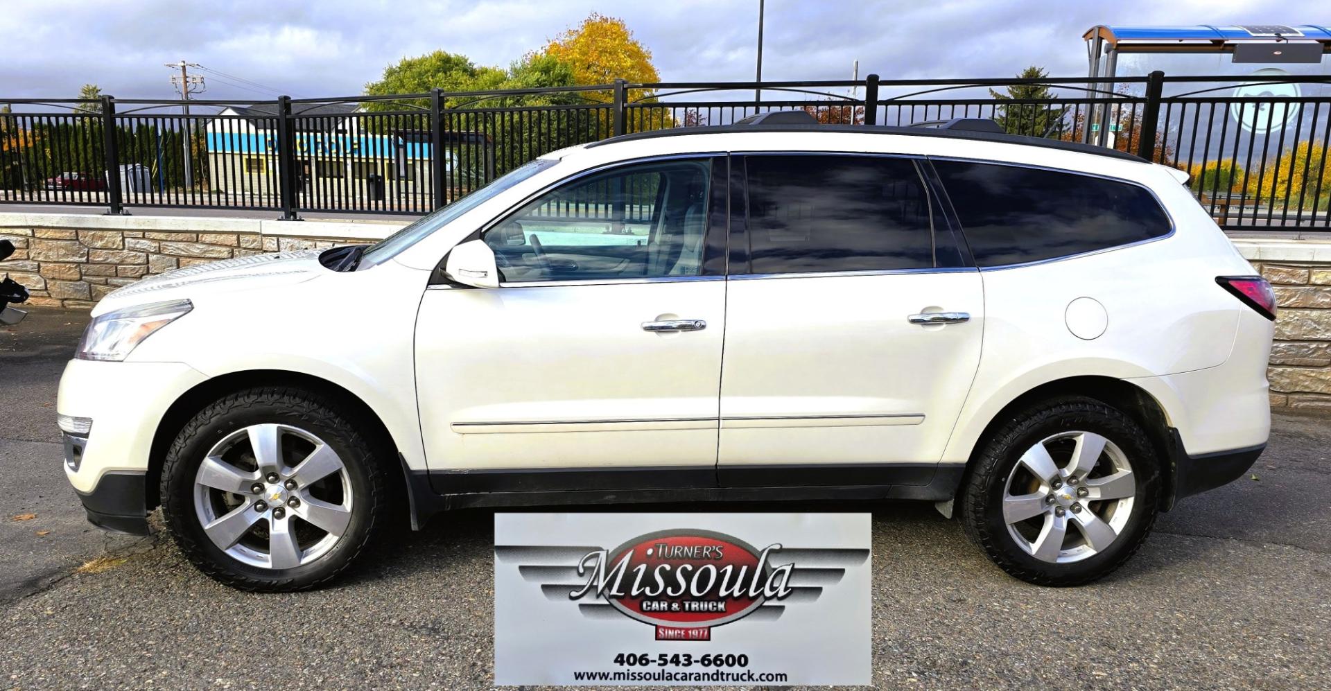 2015 White /Gray Chevrolet Traverse LTZ AWD (1GNKVJKD3FJ) with an 3.6L V6 DOHC 24V engine, 6 Speed Automatic transmission, located at 450 N Russell, Missoula, MT, 59801, (406) 543-6600, 46.874496, -114.017433 - There is a lot of car for the money here. 2015 AWD Chevy Traverse. 3.6L V6 Engine. 6 Speed Automatic Transmission. 3rd Row Seating. Navigation. Backup Camera. Heated and Cooled Front Seats. Two Sunroofs. Front and Rear Climate Control. AM FM CD Player with Touch Screen. Bluetooth Audio and Phone. Cl- Photo#1