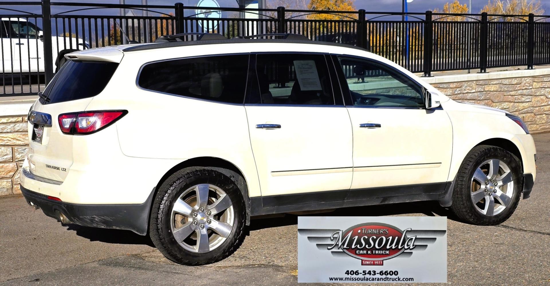 2015 White /Gray Chevrolet Traverse LTZ AWD (1GNKVJKD3FJ) with an 3.6L V6 DOHC 24V engine, 6 Speed Automatic transmission, located at 450 N Russell, Missoula, MT, 59801, (406) 543-6600, 46.874496, -114.017433 - There is a lot of car for the money here. 2015 AWD Chevy Traverse. 3.6L V6 Engine. 6 Speed Automatic Transmission. 3rd Row Seating. Navigation. Backup Camera. Heated and Cooled Front Seats. Two Sunroofs. Front and Rear Climate Control. AM FM CD Player with Touch Screen. Bluetooth Audio and Phone. Cl- Photo#7