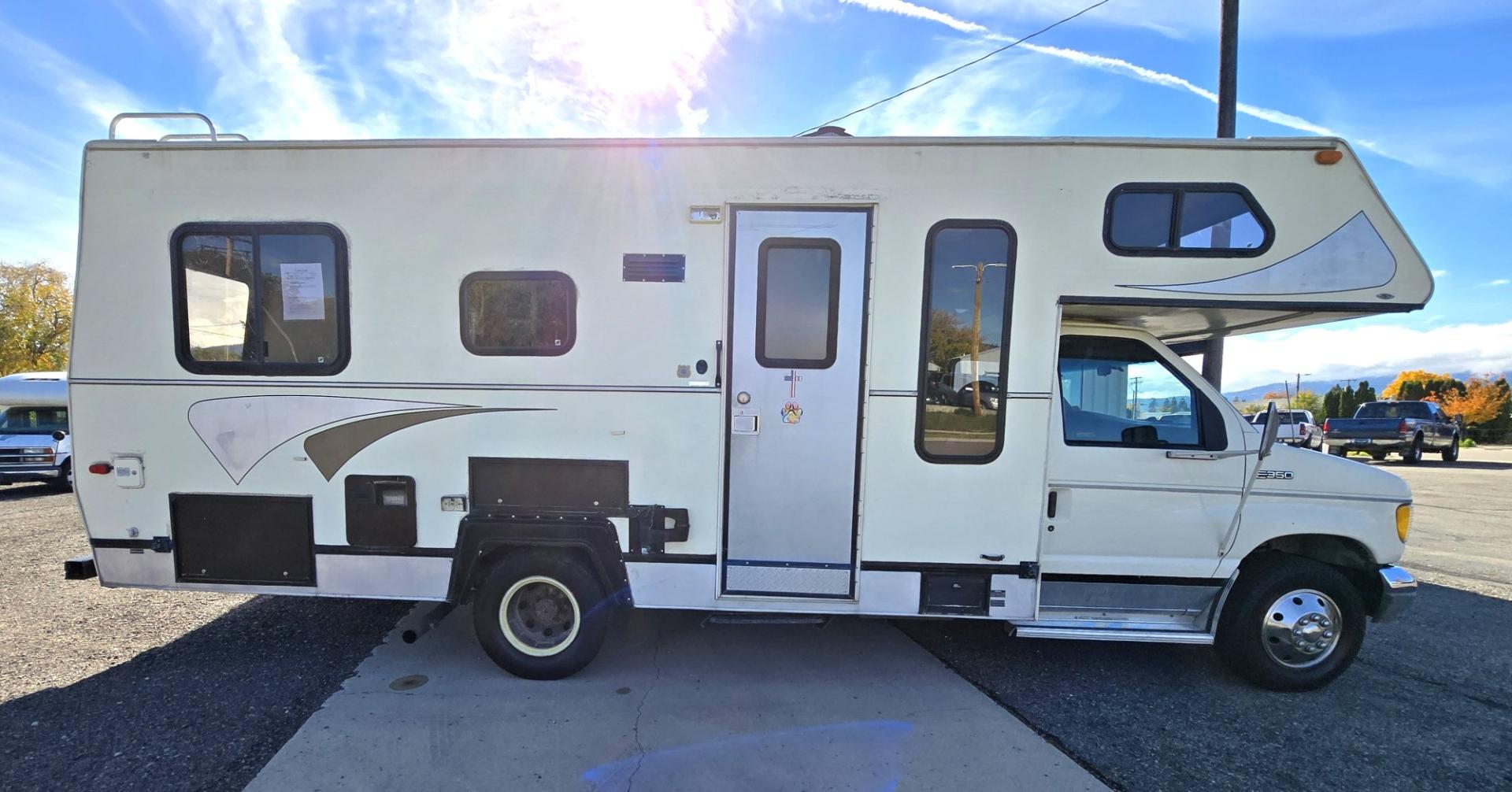 1993 White /Brown Ford Econoline E350 (1FDKE30GXPH) with an 7.5L V8 OHV 16V engine, Automatic transmission, located at 450 N Russell, Missoula, MT, 59801, (406) 543-6600, 46.874496, -114.017433 - Not Perfect but with these Miles, this Motor-home is a Steal! You read that right. Under 40K Miles. 7.5L V8 Engine. Like New Michelin Tires all around. RV was just winterized. Plumbing seems good. Electrical works on plug in. Fridge will run on electric or propane(hasn't been tested). Bed in front h- Photo#0