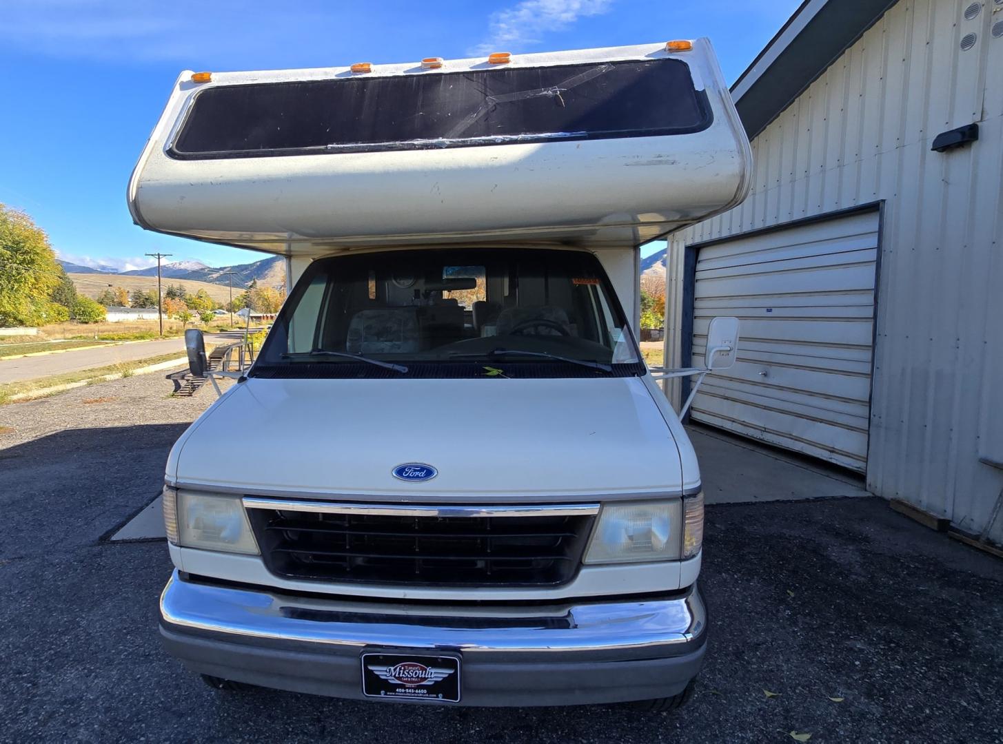 1993 White /Brown Ford Econoline E350 (1FDKE30GXPH) with an 7.5L V8 OHV 16V engine, Automatic transmission, located at 450 N Russell, Missoula, MT, 59801, (406) 543-6600, 46.874496, -114.017433 - Not Perfect but with these Miles, this Motor-home is a Steal! You read that right. Under 40K Miles. 7.5L V8 Engine. Like New Michelin Tires all around. RV was just winterized. Plumbing seems good. Electrical works on plug in. Fridge will run on electric or propane(hasn't been tested). Bed in front h- Photo#3