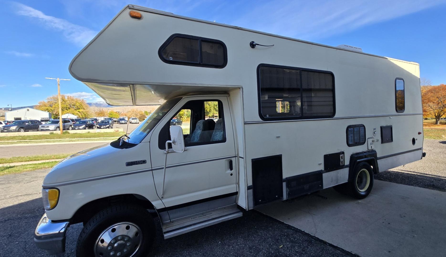 1993 White /Brown Ford Econoline E350 (1FDKE30GXPH) with an 7.5L V8 OHV 16V engine, Automatic transmission, located at 450 N Russell, Missoula, MT, 59801, (406) 543-6600, 46.874496, -114.017433 - Not Perfect but with these Miles, this Motor-home is a Steal! You read that right. Under 40K Miles. 7.5L V8 Engine. Like New Michelin Tires all around. RV was just winterized. Plumbing seems good. Electrical works on plug in. Fridge will run on electric or propane(hasn't been tested). Bed in front h- Photo#5