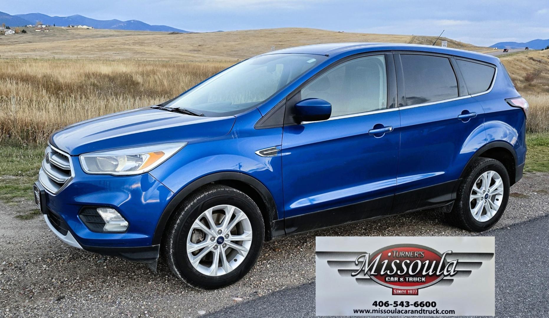 2017 Blue /Gray Ford Escape SE 4WD (1FMCU9GD9HU) with an 1.5L L4 DOHC 16V engine, 6A transmission, located at 450 N Russell, Missoula, MT, 59801, (406) 543-6600, 46.874496, -114.017433 - Cute little One Owner AWD SUV with Goodyear Tires all around. Ready for Winter Roads or Summer Cruising. Fuel Economy Friendly 1.4L I4 Engine. 6 Speed Automatic Transmission. Power Drivers Seat. Dual Climate Control. AM FM CD Player with Bluetooth Audio and Phone Connectivity. Backup Camera. Has a s- Photo#3