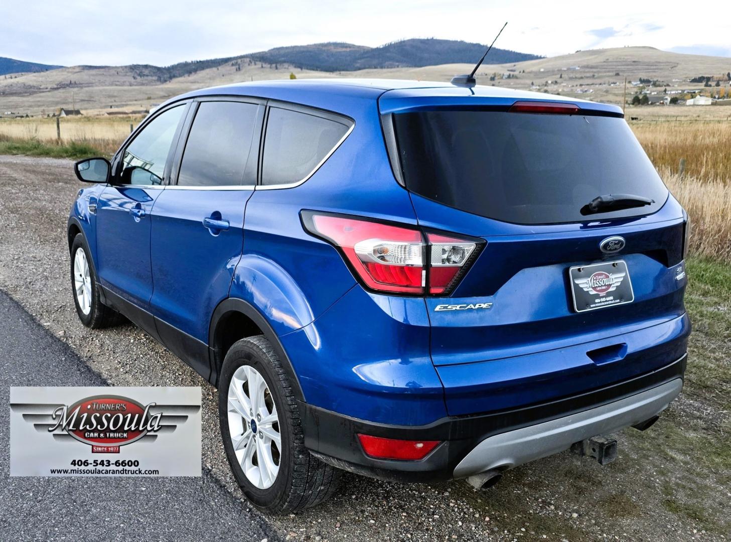 2017 Blue /Gray Ford Escape SE 4WD (1FMCU9GD9HU) with an 1.5L L4 DOHC 16V engine, 6A transmission, located at 450 N Russell, Missoula, MT, 59801, (406) 543-6600, 46.874496, -114.017433 - Cute little One Owner AWD SUV with Goodyear Tires all around. Ready for Winter Roads or Summer Cruising. Fuel Economy Friendly 1.4L I4 Engine. 6 Speed Automatic Transmission. Power Drivers Seat. Dual Climate Control. AM FM CD Player with Bluetooth Audio and Phone Connectivity. Backup Camera. Has a s- Photo#5