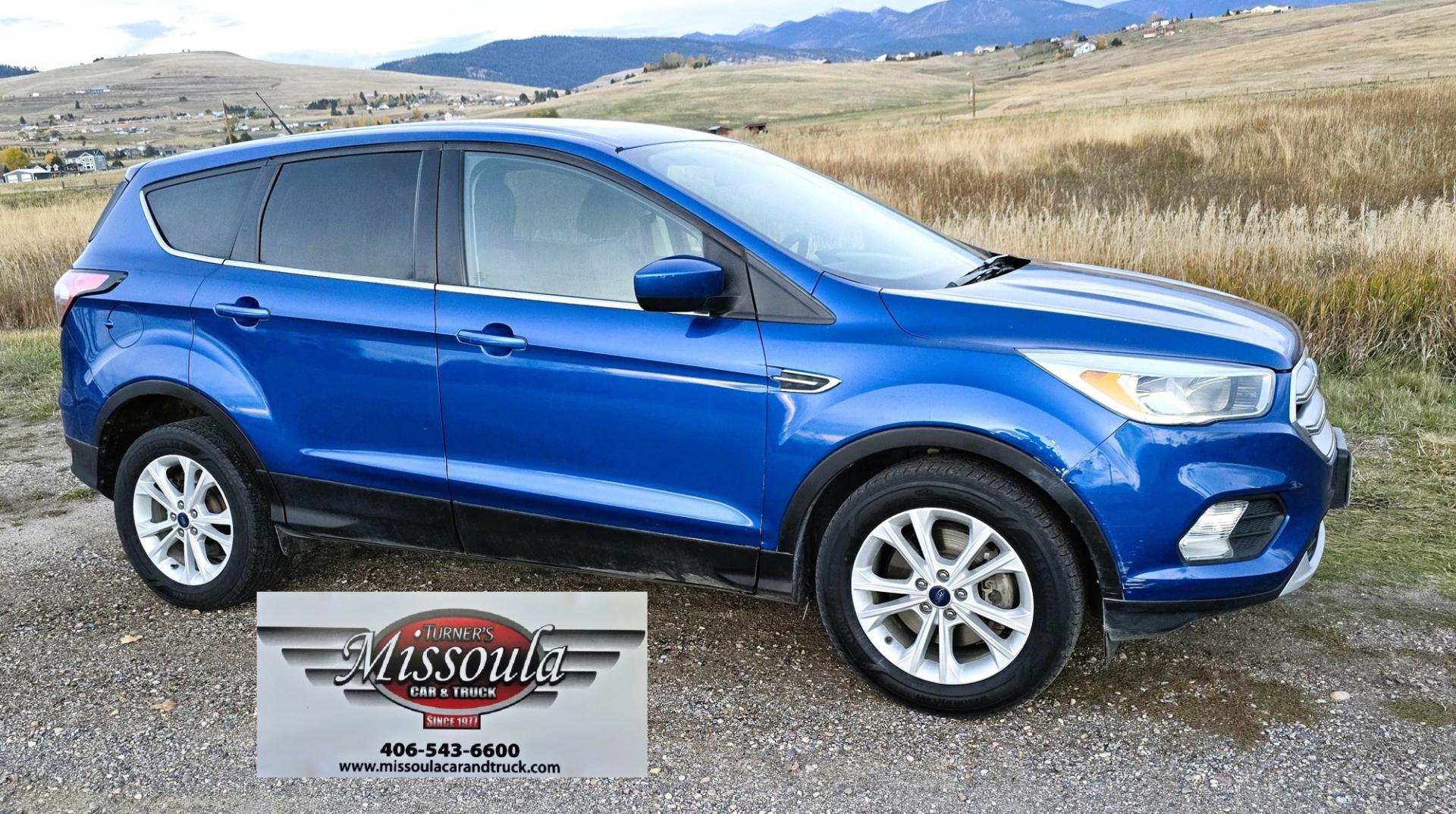 2017 Blue /Gray Ford Escape SE 4WD (1FMCU9GD9HU) with an 1.5L L4 DOHC 16V engine, 6A transmission, located at 450 N Russell, Missoula, MT, 59801, (406) 543-6600, 46.874496, -114.017433 - Cute little One Owner AWD SUV with Goodyear Tires all around. Ready for Winter Roads or Summer Cruising. Fuel Economy Friendly 1.4L I4 Engine. 6 Speed Automatic Transmission. Power Drivers Seat. Dual Climate Control. AM FM CD Player with Bluetooth Audio and Phone Connectivity. Backup Camera. Has a s- Photo#7