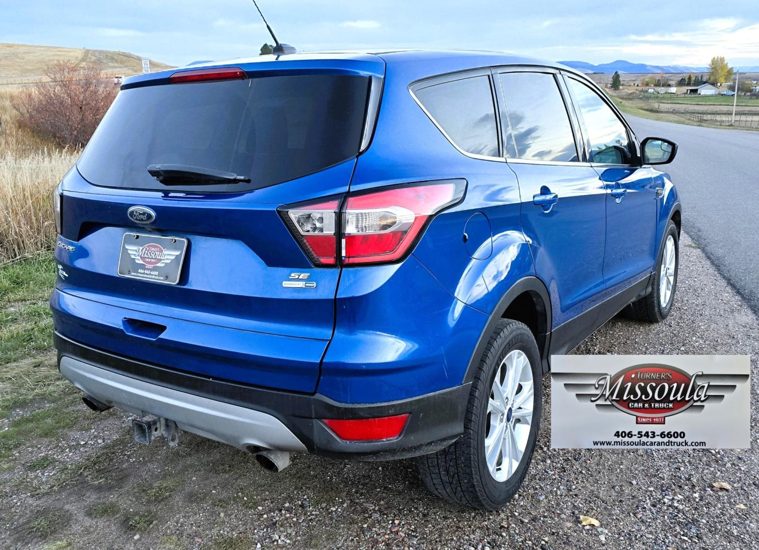 2017 Blue /Gray Ford Escape SE 4WD (1FMCU9GD9HU) with an 1.5L L4 DOHC 16V engine, 6A transmission, located at 450 N Russell, Missoula, MT, 59801, (406) 543-6600, 46.874496, -114.017433 - Cute little One Owner AWD SUV with Goodyear Tires all around. Ready for Winter Roads or Summer Cruising. Fuel Economy Friendly 1.4L I4 Engine. 6 Speed Automatic Transmission. Power Drivers Seat. Dual Climate Control. AM FM CD Player with Bluetooth Audio and Phone Connectivity. Backup Camera. Has a s- Photo#10
