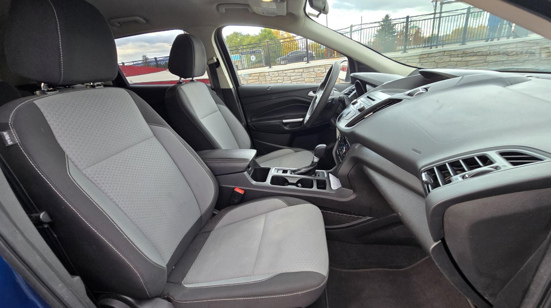 2017 Blue /Gray Ford Escape SE 4WD (1FMCU9GD9HU) with an 1.5L L4 DOHC 16V engine, 6A transmission, located at 450 N Russell, Missoula, MT, 59801, (406) 543-6600, 46.874496, -114.017433 - Cute little One Owner AWD SUV with Goodyear Tires all around. Ready for Winter Roads or Summer Cruising. Fuel Economy Friendly 1.4L I4 Engine. 6 Speed Automatic Transmission. Power Drivers Seat. Dual Climate Control. AM FM CD Player with Bluetooth Audio and Phone Connectivity. Backup Camera. Has a s- Photo#12