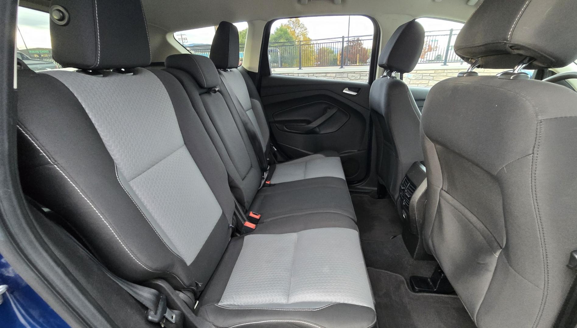 2017 Blue /Gray Ford Escape SE 4WD (1FMCU9GD9HU) with an 1.5L L4 DOHC 16V engine, 6A transmission, located at 450 N Russell, Missoula, MT, 59801, (406) 543-6600, 46.874496, -114.017433 - Cute little One Owner AWD SUV with Goodyear Tires all around. Ready for Winter Roads or Summer Cruising. Fuel Economy Friendly 1.4L I4 Engine. 6 Speed Automatic Transmission. Power Drivers Seat. Dual Climate Control. AM FM CD Player with Bluetooth Audio and Phone Connectivity. Backup Camera. Has a s- Photo#11