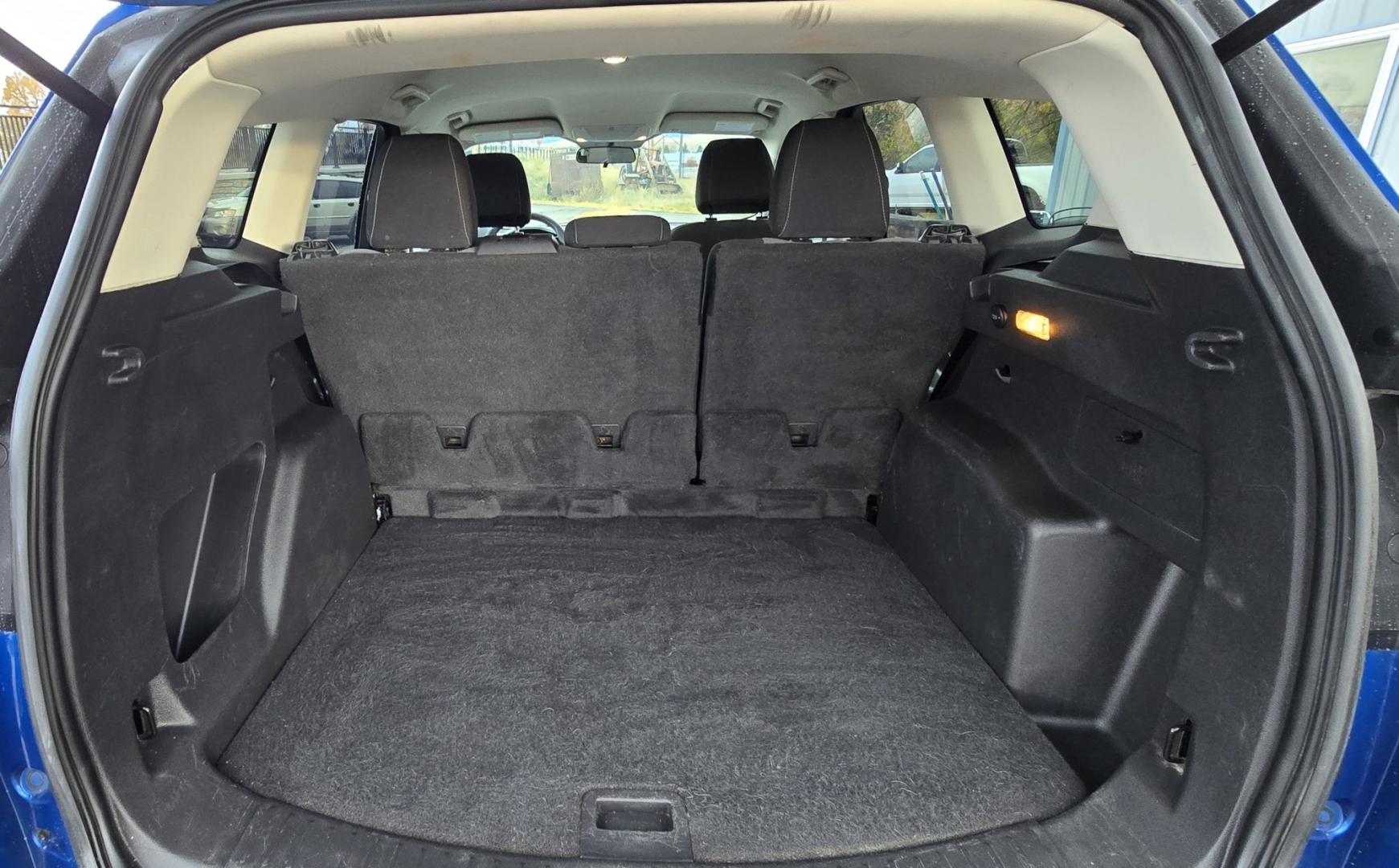 2017 Blue /Gray Ford Escape SE 4WD (1FMCU9GD9HU) with an 1.5L L4 DOHC 16V engine, 6A transmission, located at 450 N Russell, Missoula, MT, 59801, (406) 543-6600, 46.874496, -114.017433 - Cute little One Owner AWD SUV with Goodyear Tires all around. Ready for Winter Roads or Summer Cruising. Fuel Economy Friendly 1.4L I4 Engine. 6 Speed Automatic Transmission. Power Drivers Seat. Dual Climate Control. AM FM CD Player with Bluetooth Audio and Phone Connectivity. Backup Camera. Has a s- Photo#13